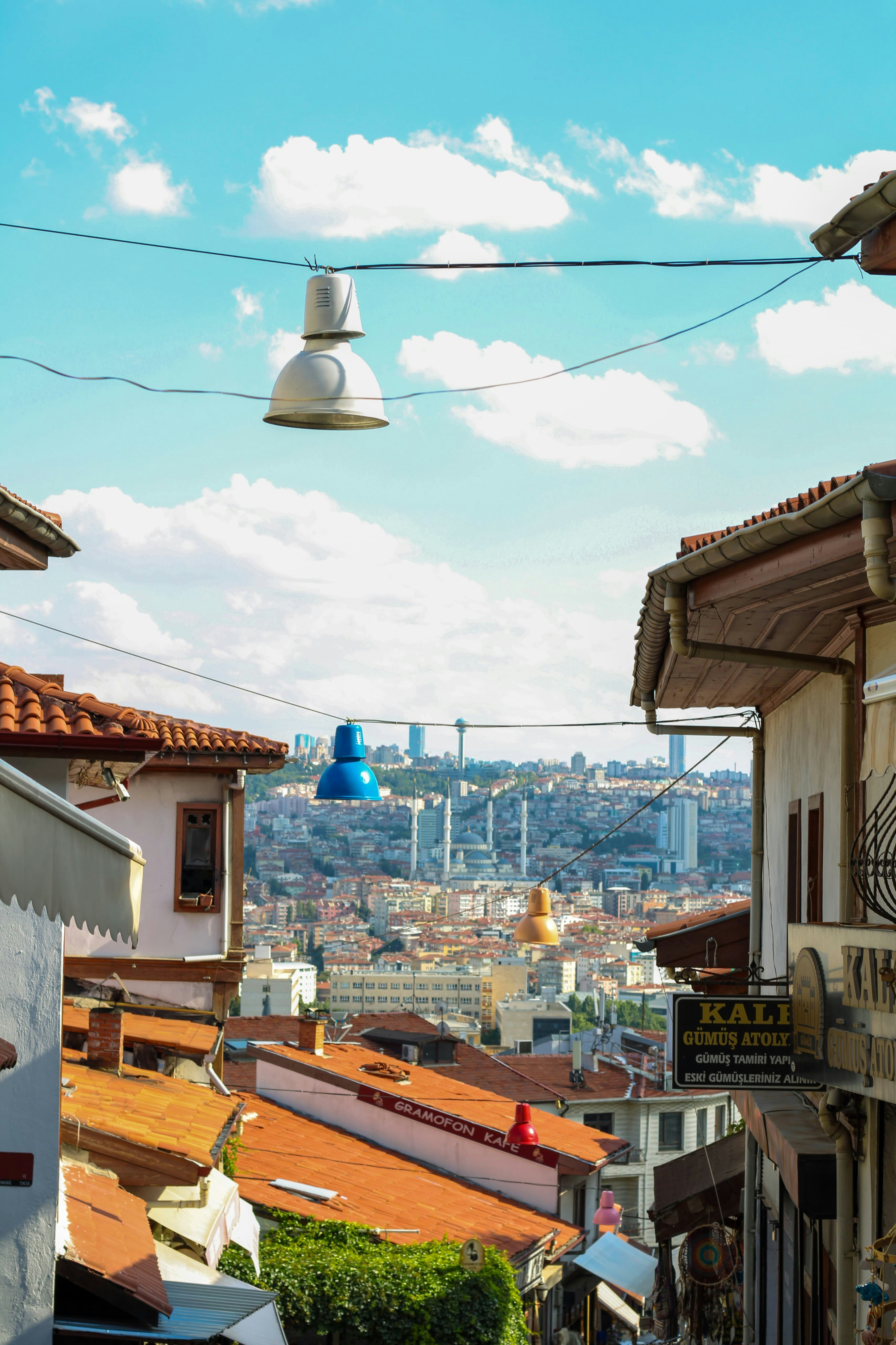 View of a city skyline between old buildings.