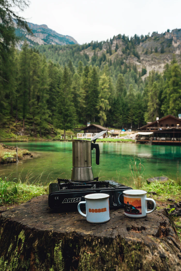Outdoor coffee setup by a lake — representative category image
