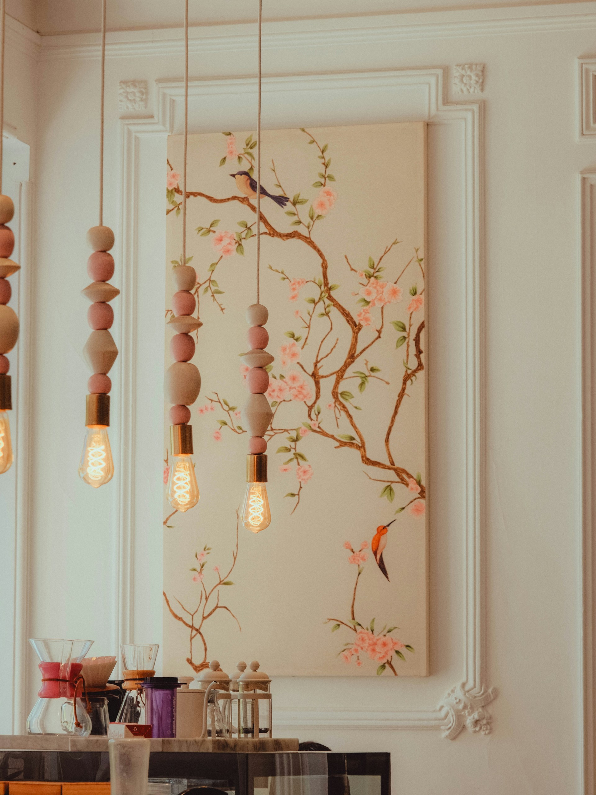 Painting of birds on a blooming cherry blossom branch.