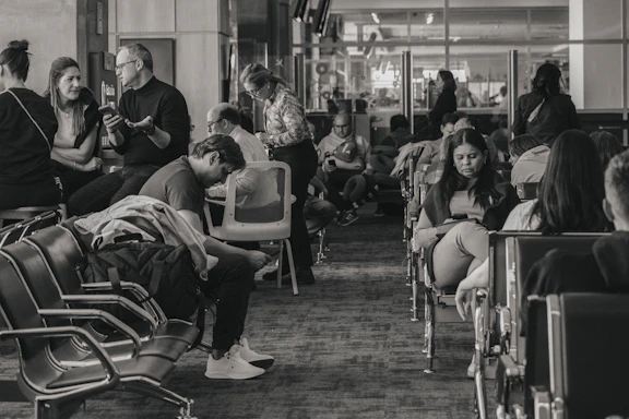 People waiting in an airport terminal