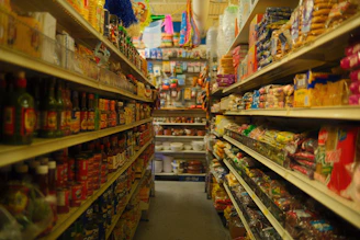 Aisle of shelves stocked with groceries in a store