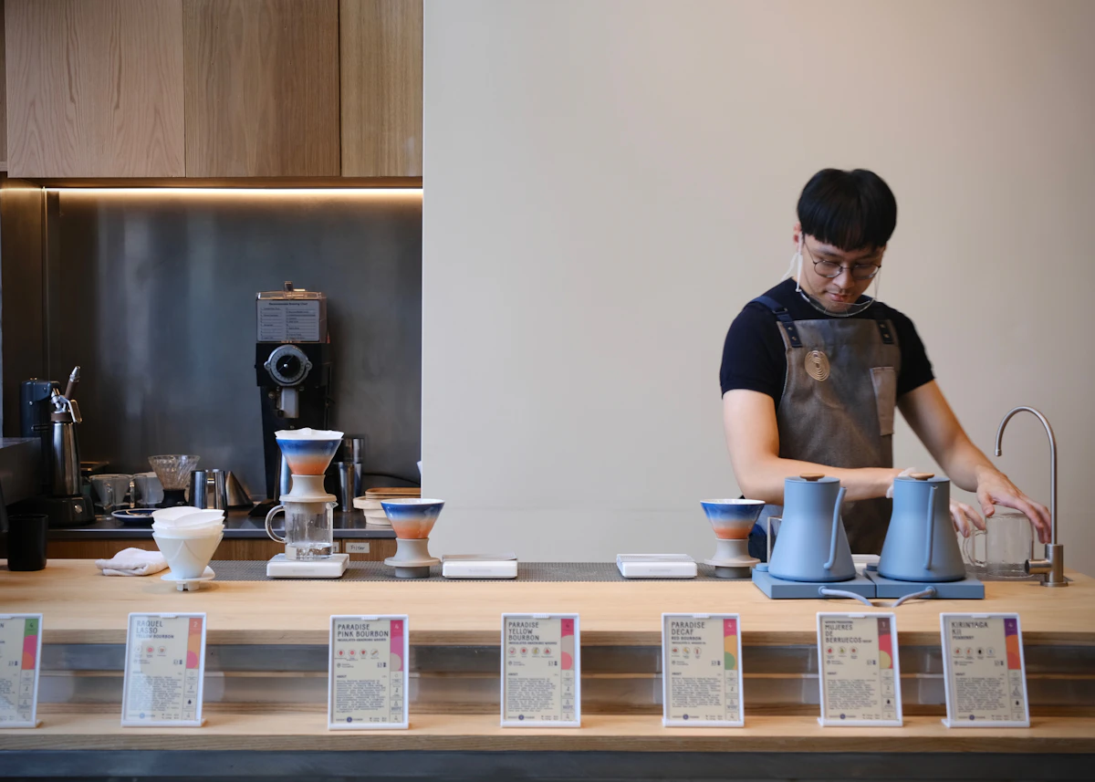 A Japanese specialty coffee shop with hand-pour coffee being prepared at the counter