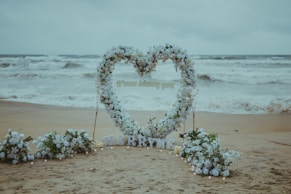Heart-shaped floral arch on a beach