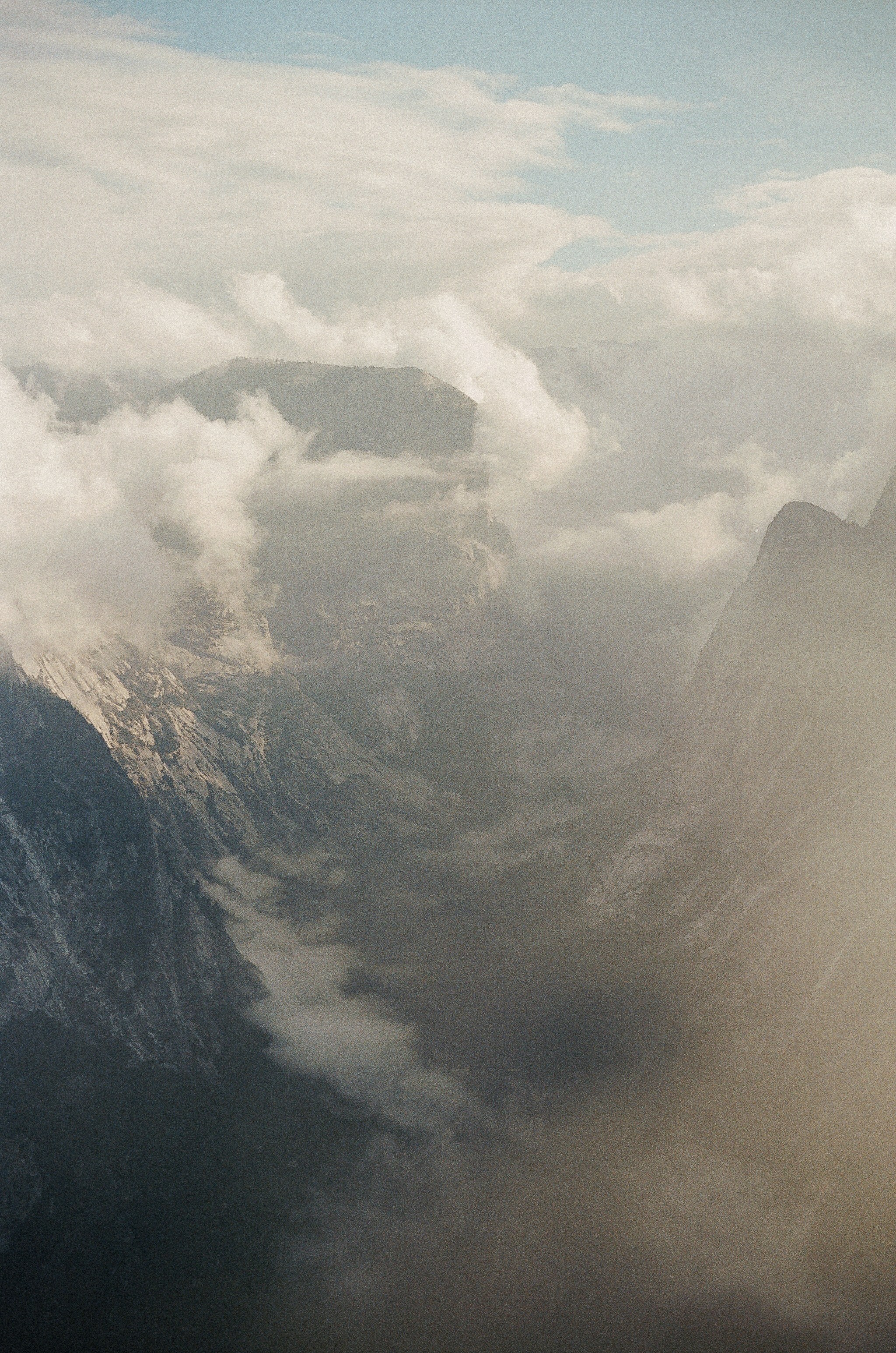 Misty mountain peaks shrouded in clouds