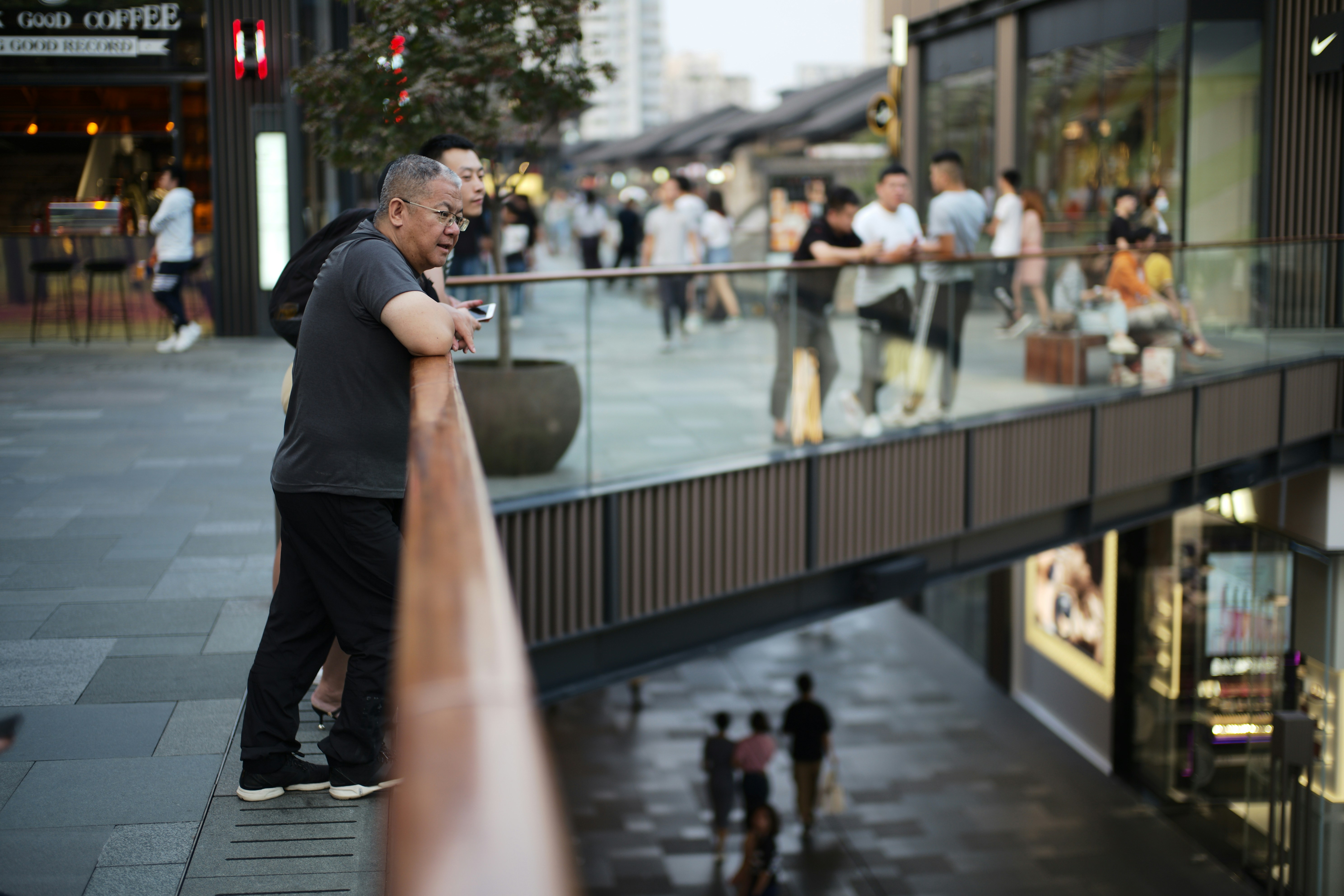 People gathered on a modern elevated walkway