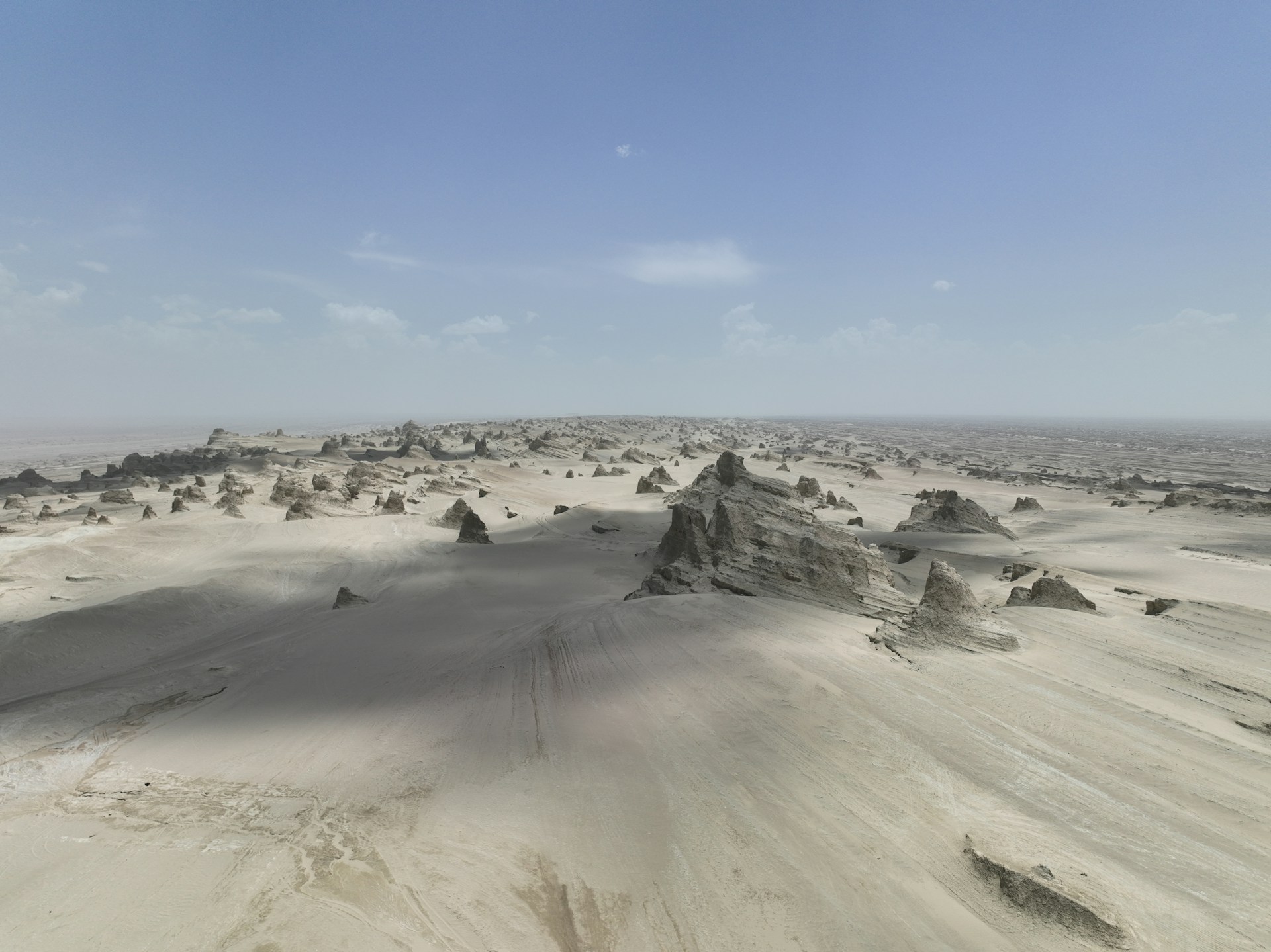 Desert landscape with strange rock formations under a clear sky