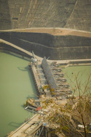 Large dam structure with water gates and reservoir