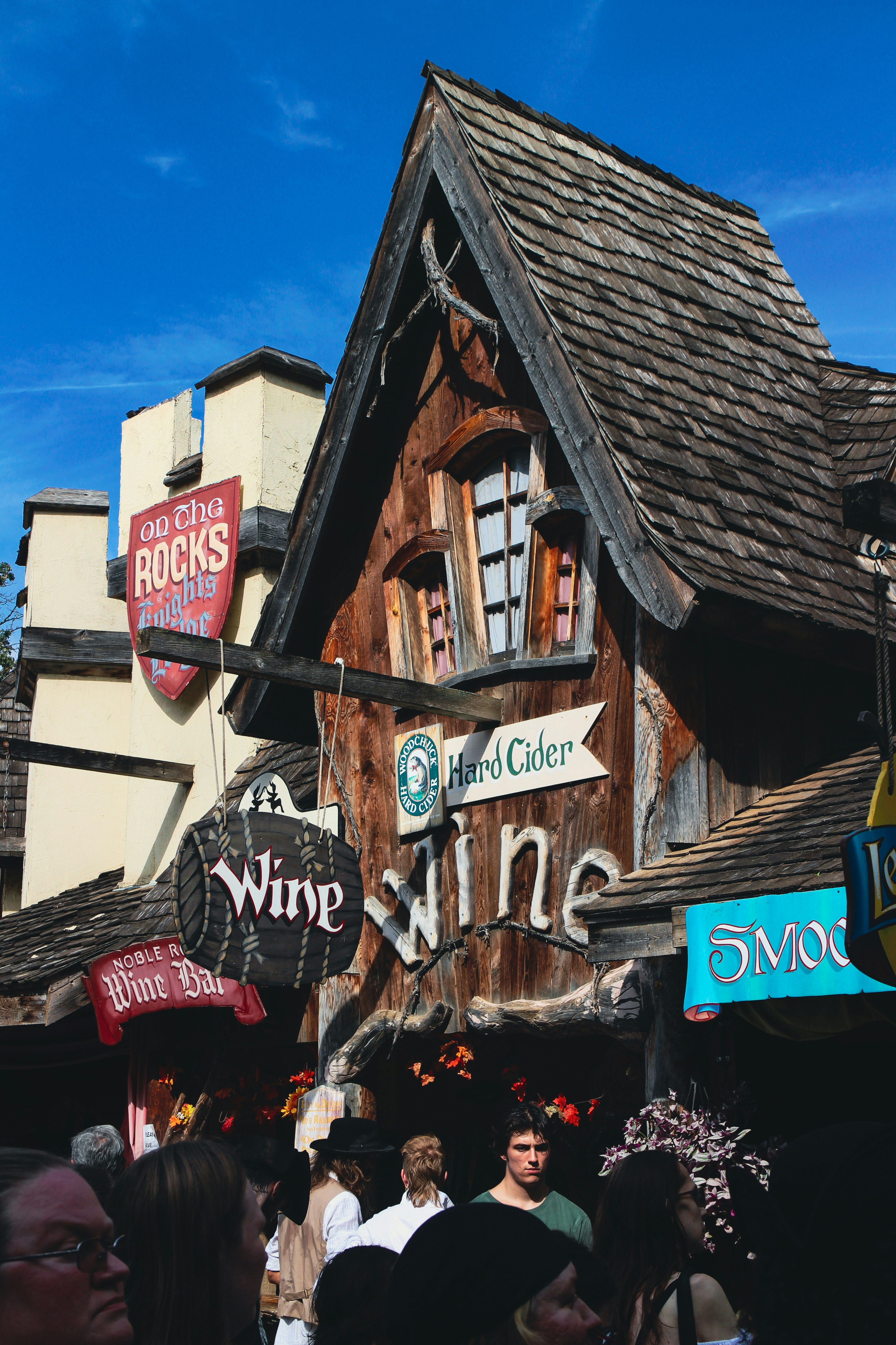 Wooden building with wine and hard cider signs.