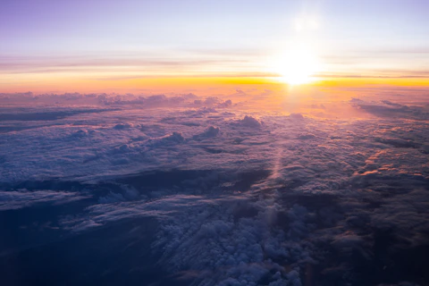 Sunrise over a sea of clouds from above