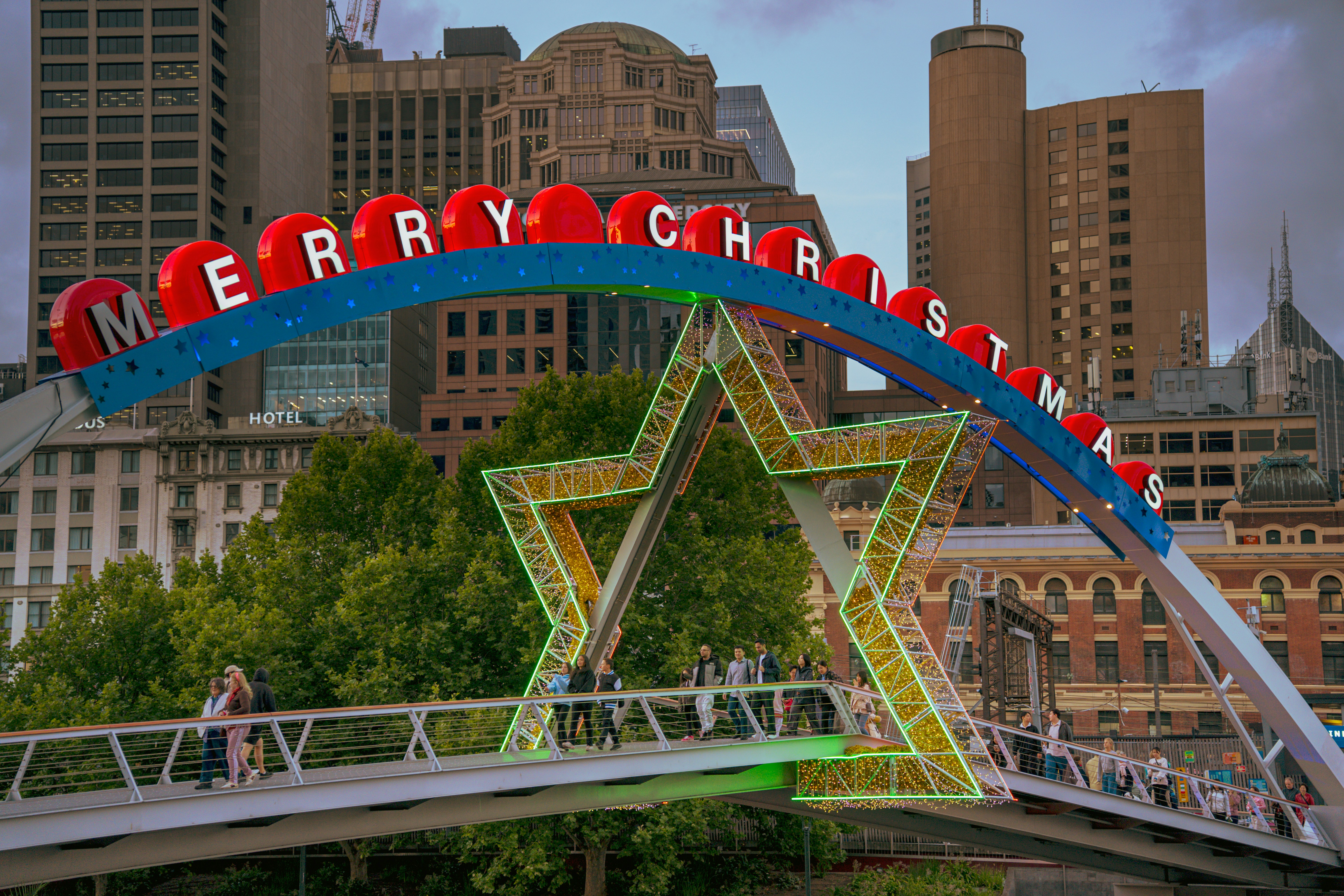 Merry christmas archway with star decoration over bridge