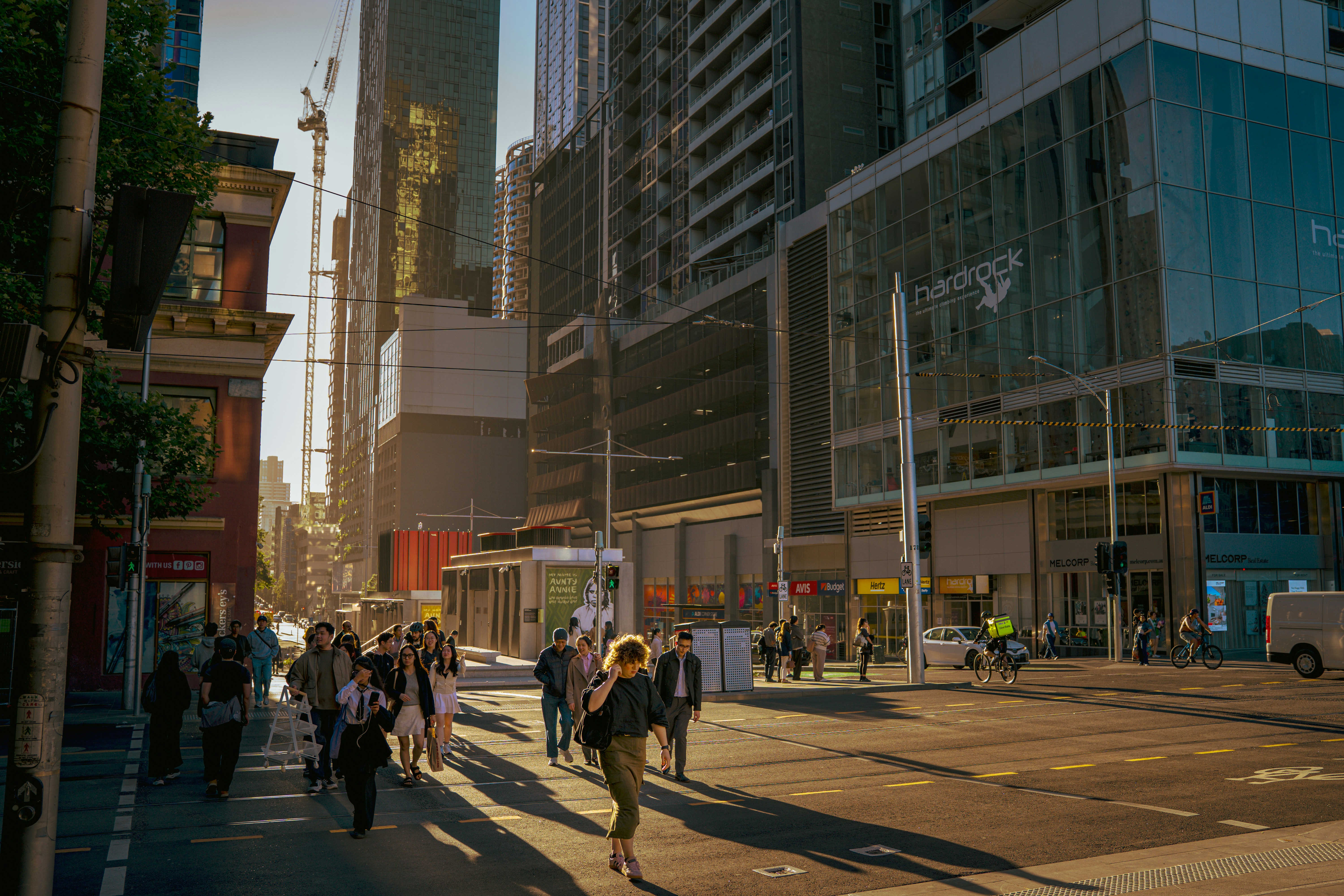 People walking on a city street during the day.