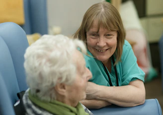 Two women talking in comfortable chairs