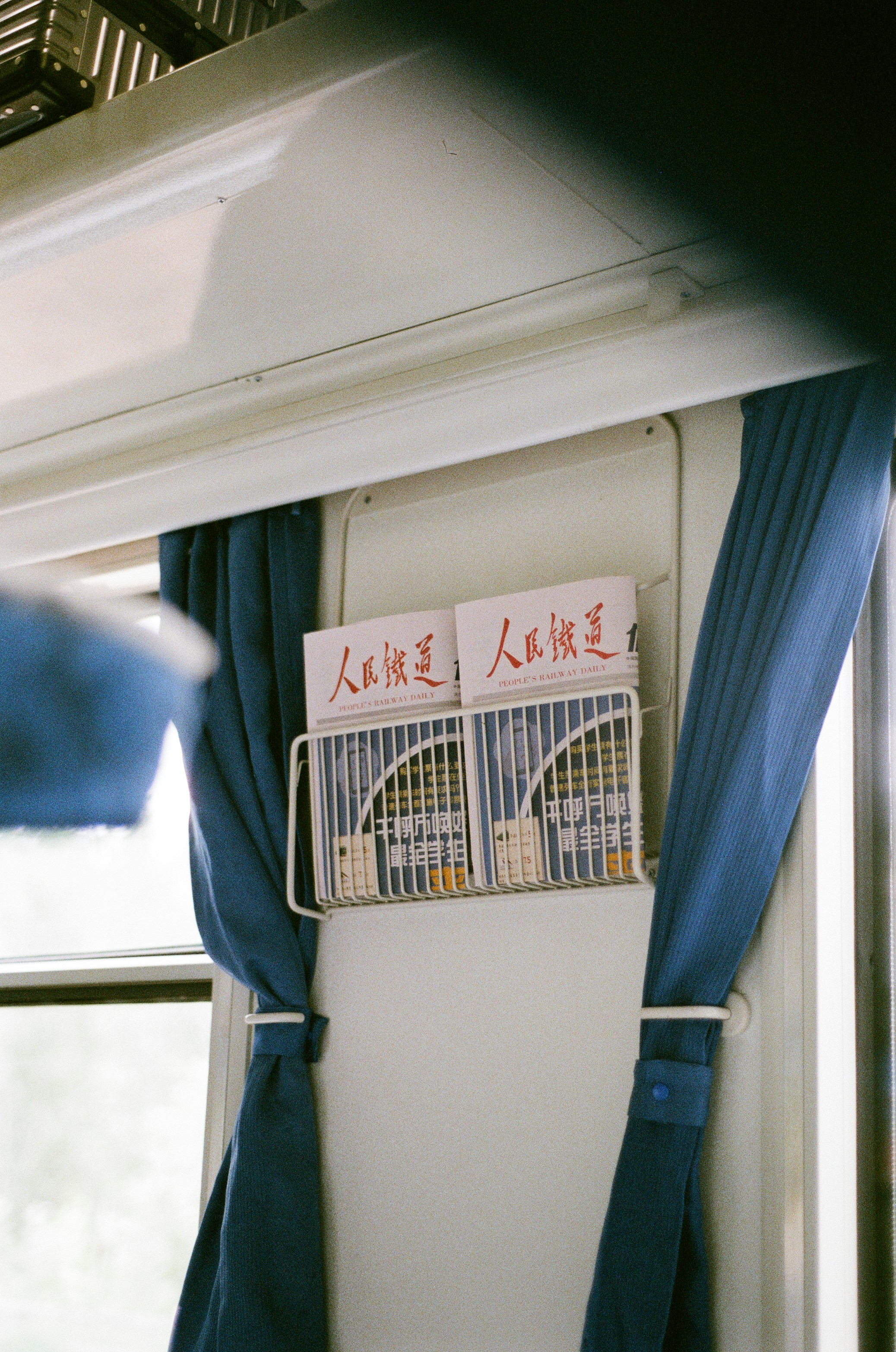 Magazines in a rack on a train
