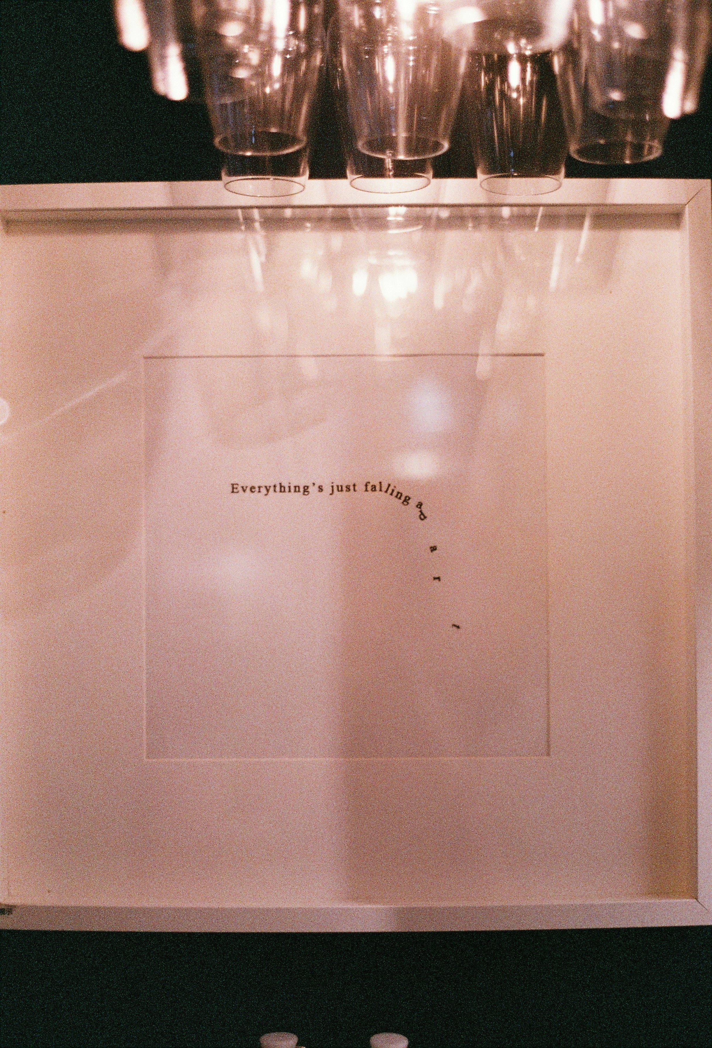 Framed text with falling dots