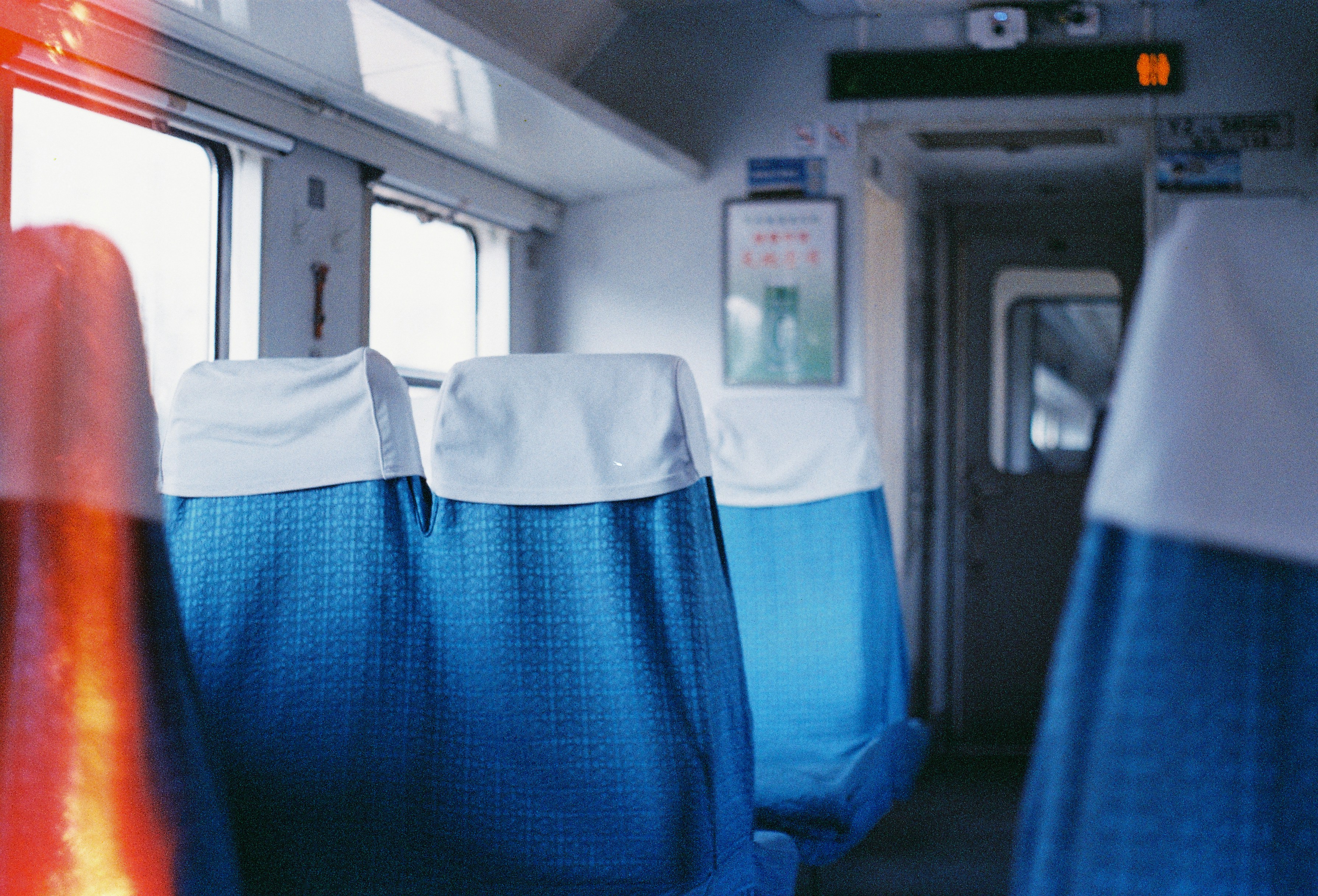 Empty blue seats inside a train carriage