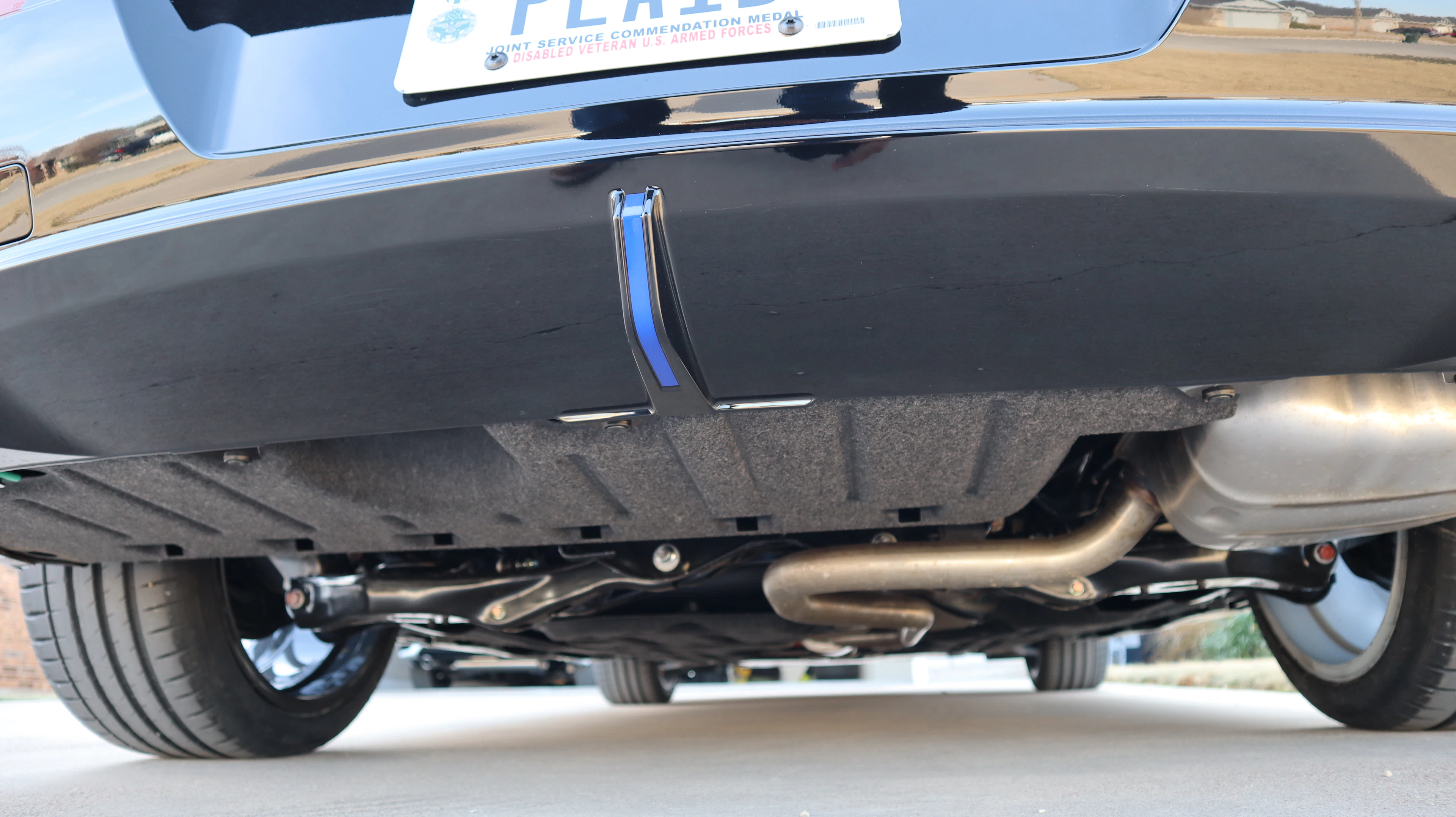 Underside of a car showing the exhaust system