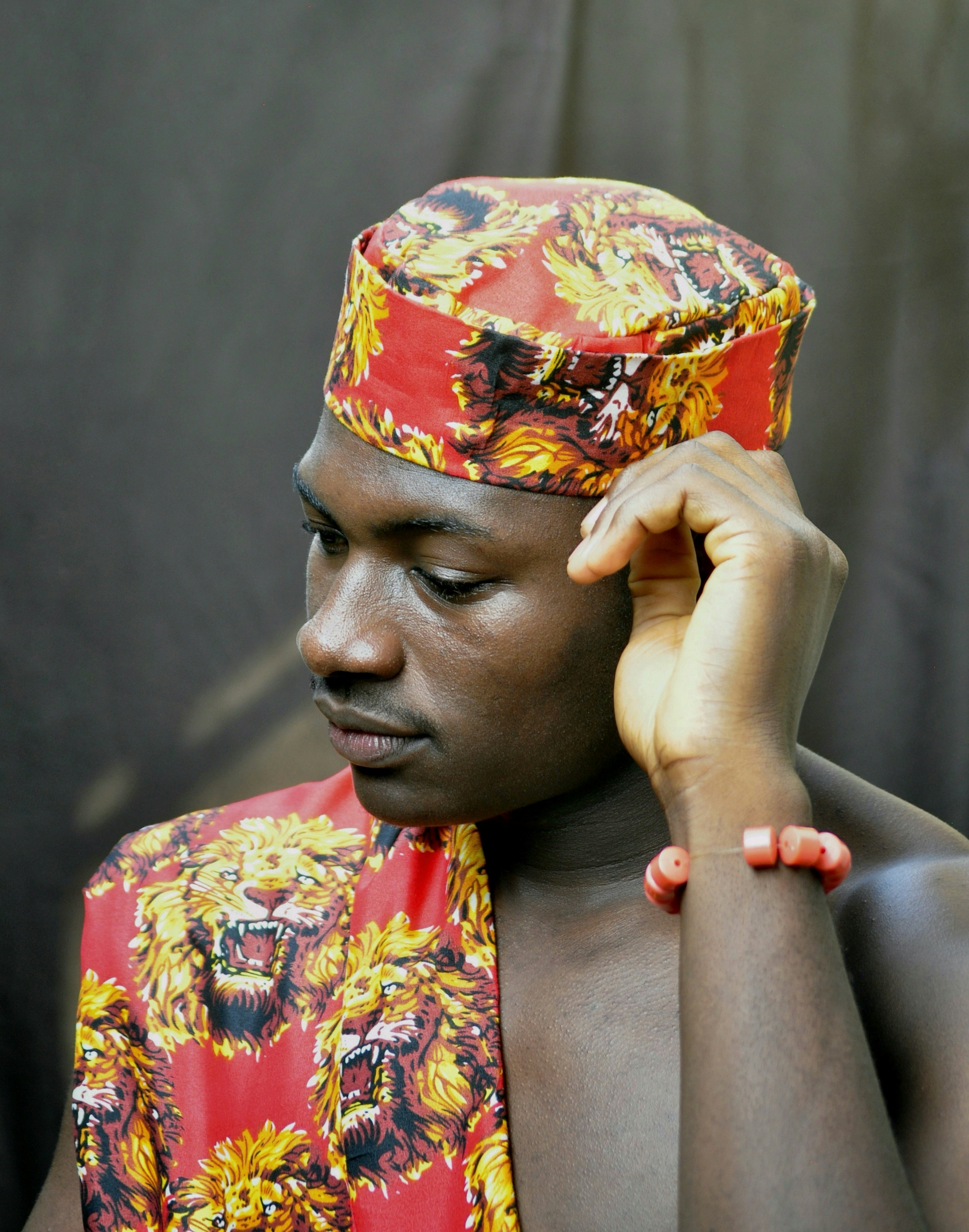 Man in traditional attire with lion print
