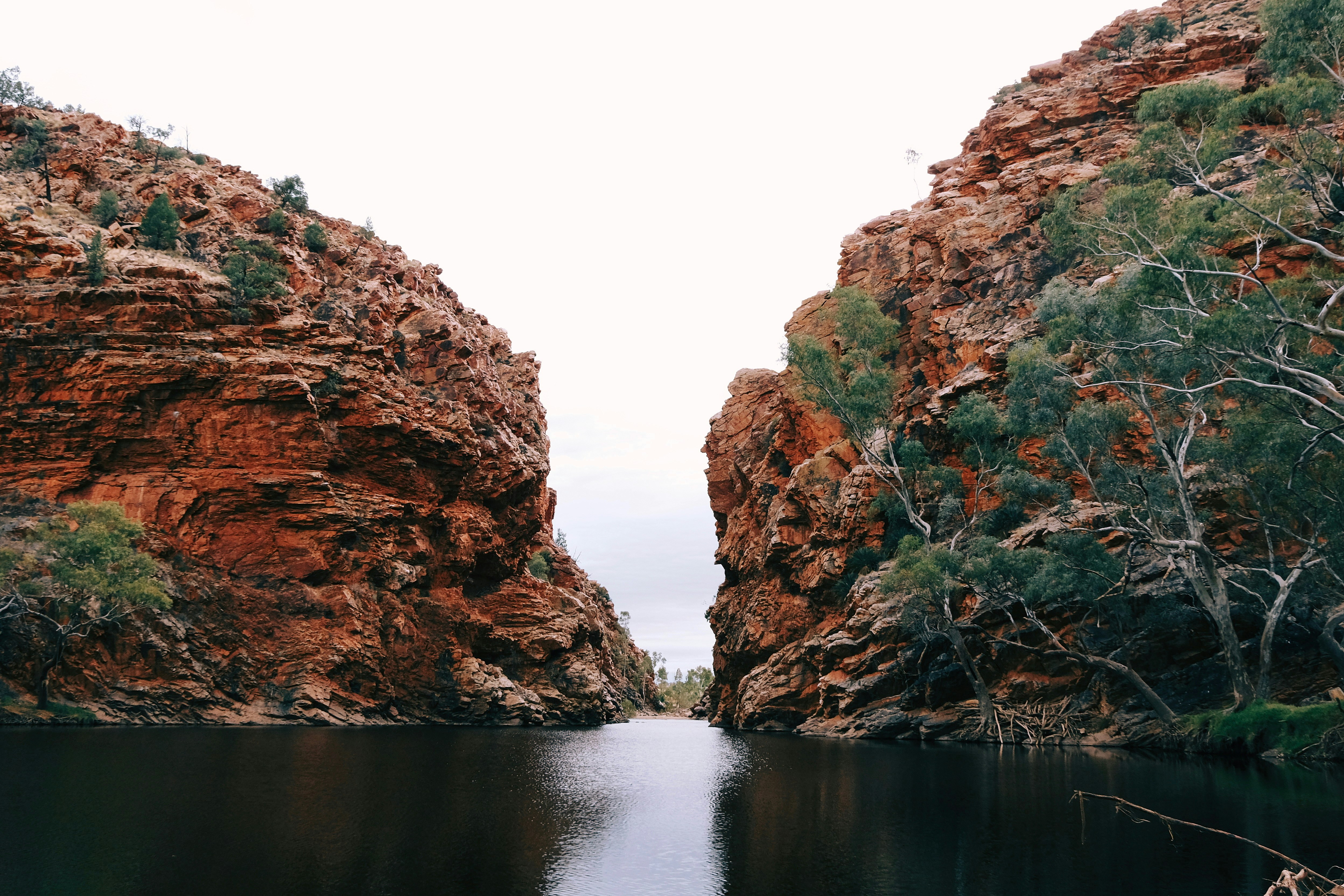 Red rock canyon with a calm river flowing through