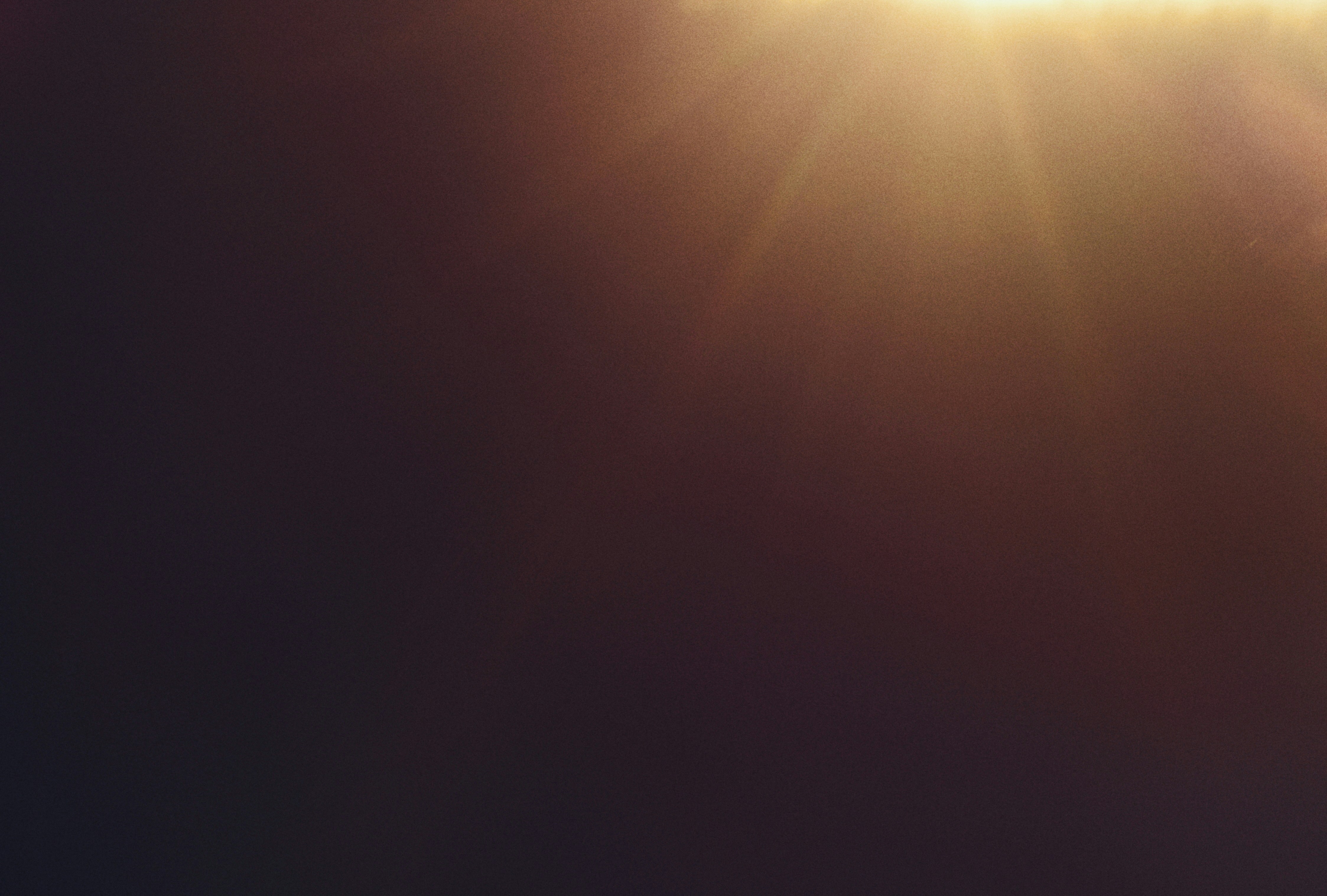 Golden sun rays breaking through darkness