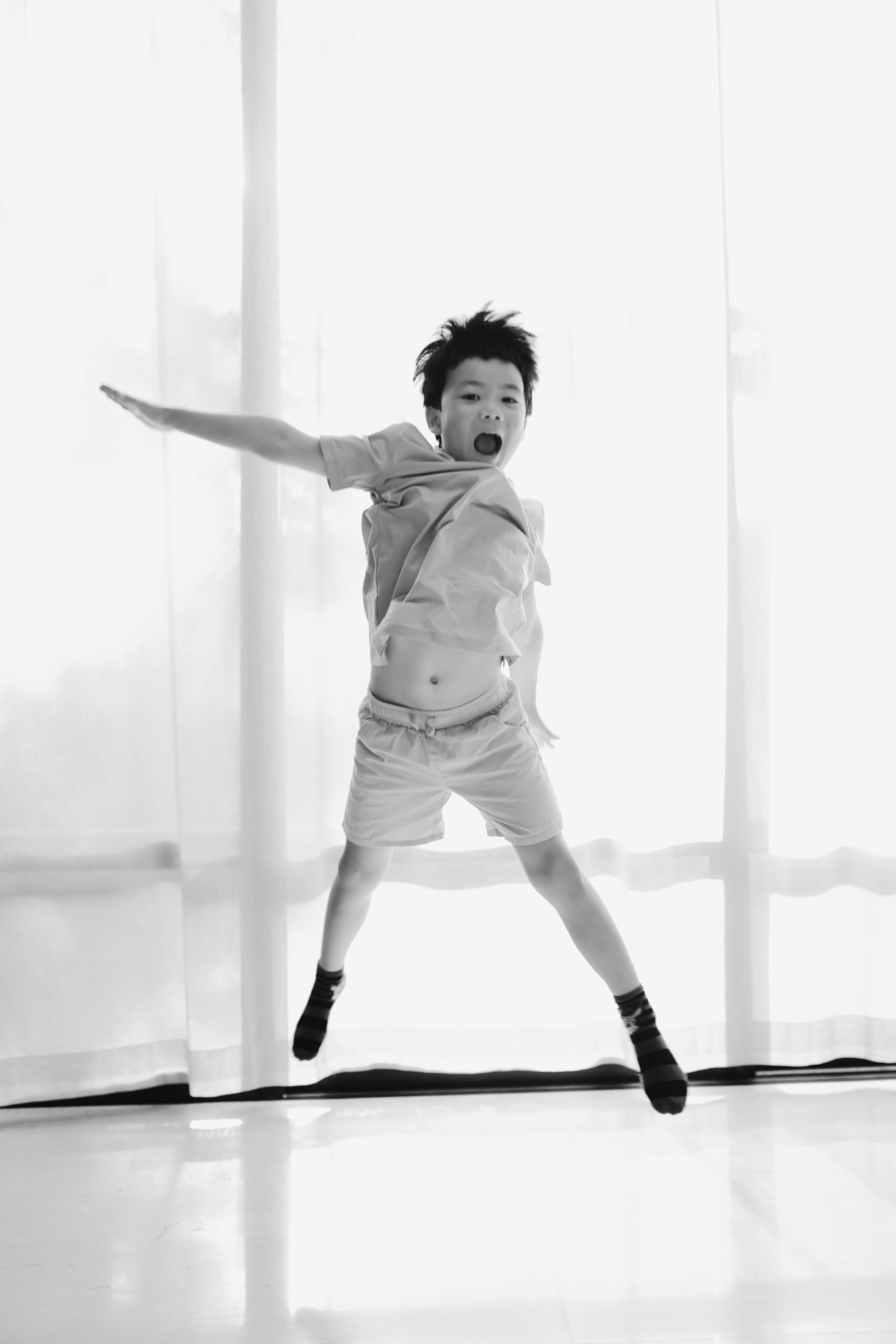 Young boy jumping in the air with excitement