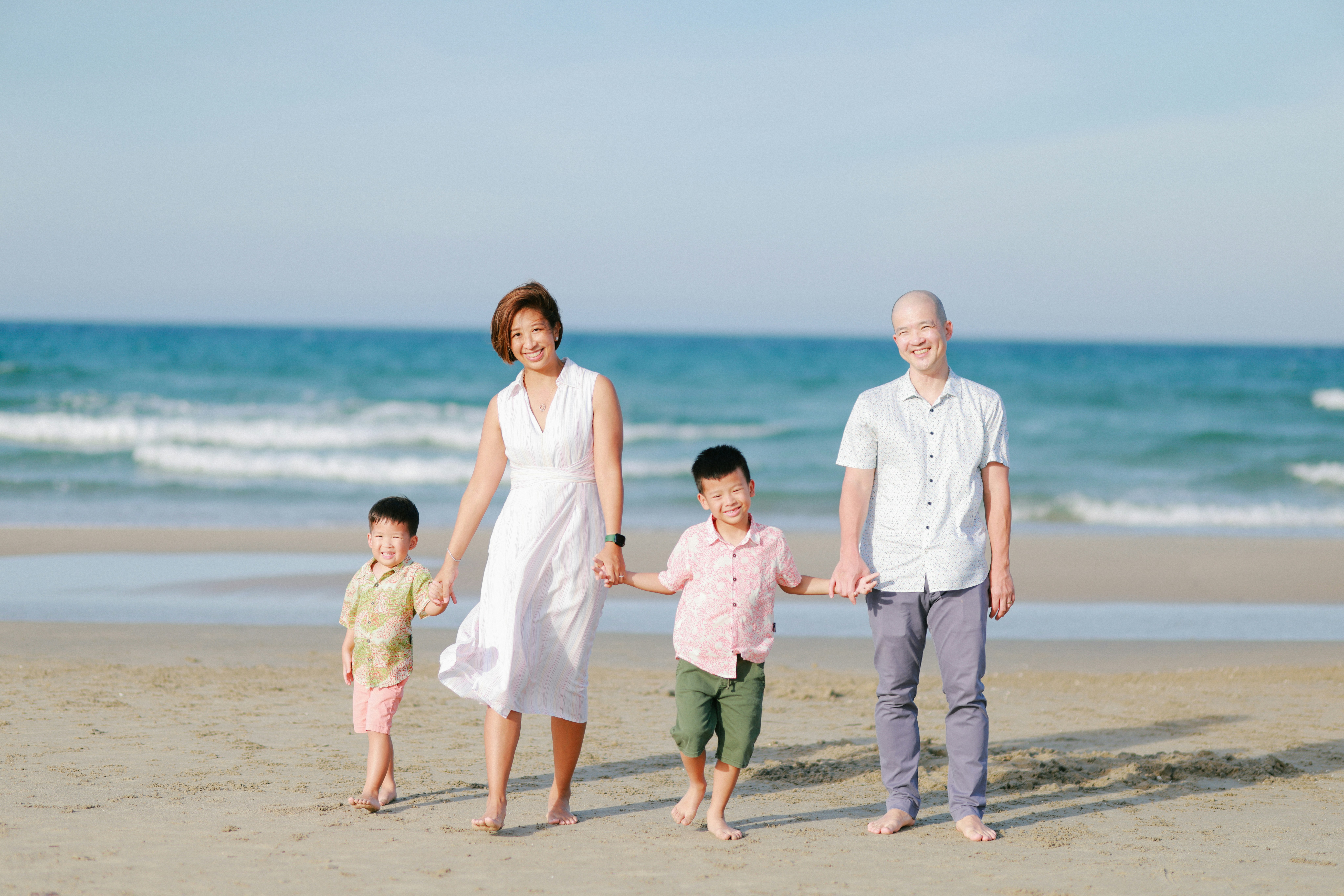 Family walking together on a beach