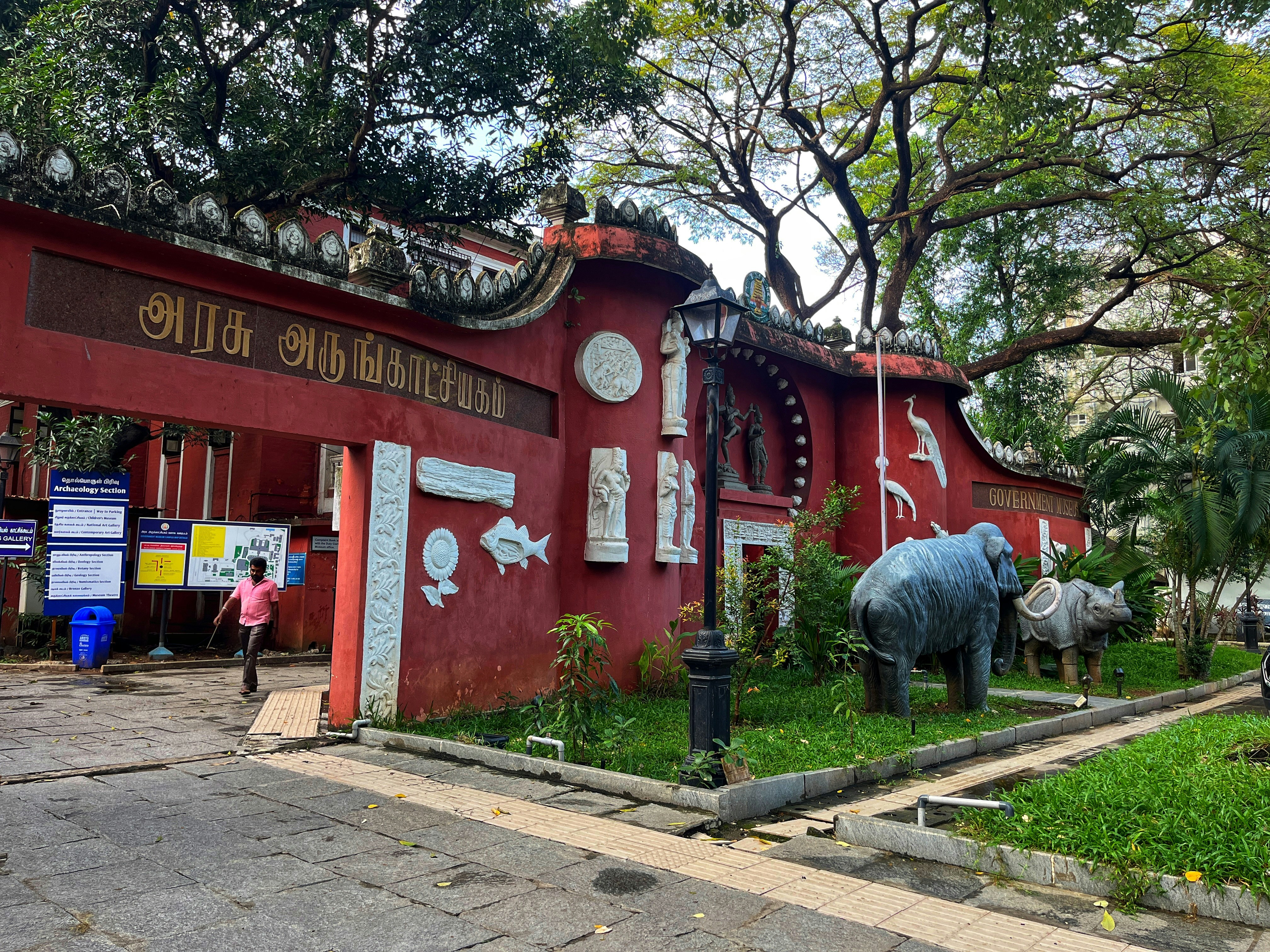 Red building entrance with elephant and rhino statues