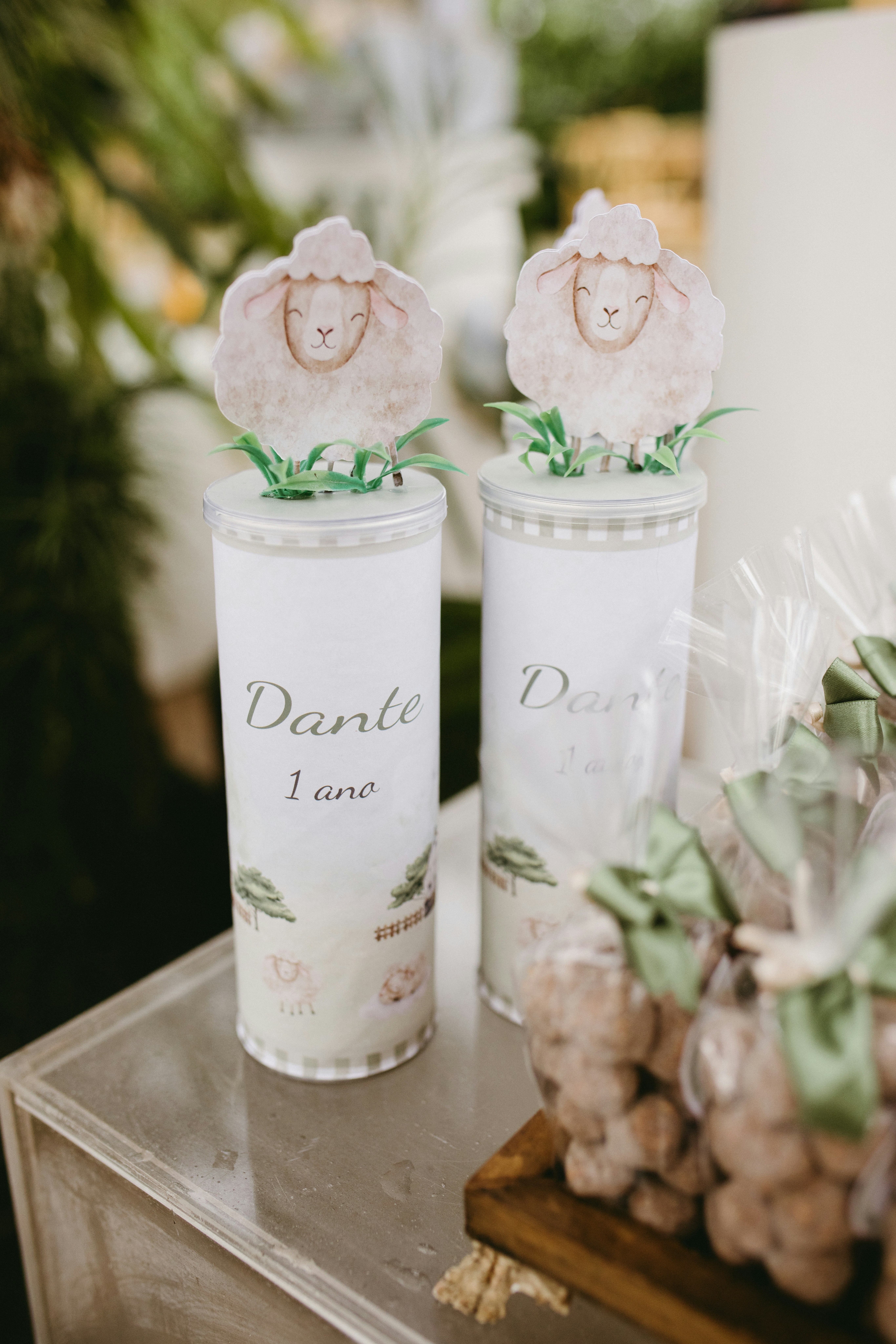 Two decorative jars with sheep toppers and cookies