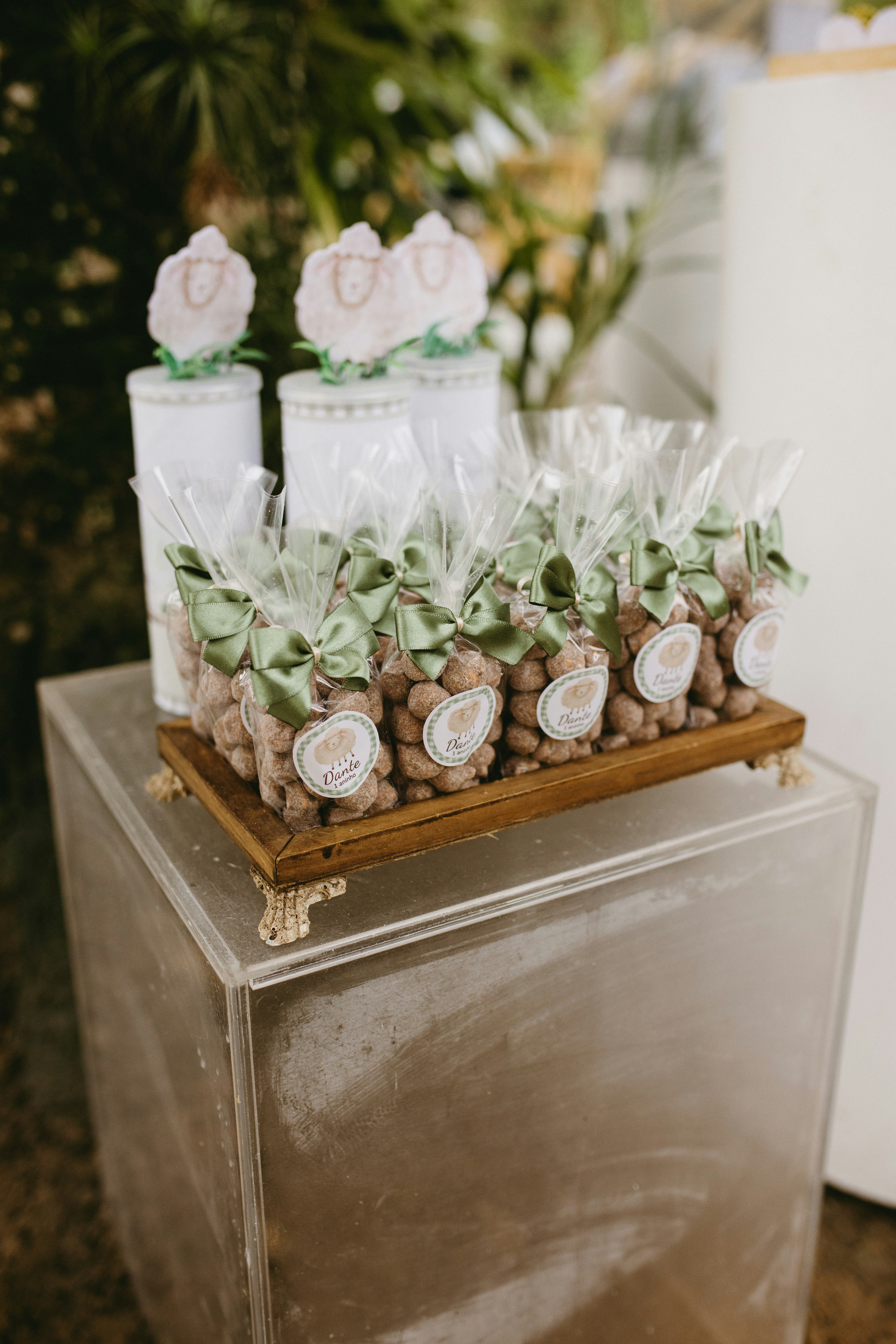 Small bags of nuts tied with green ribbon