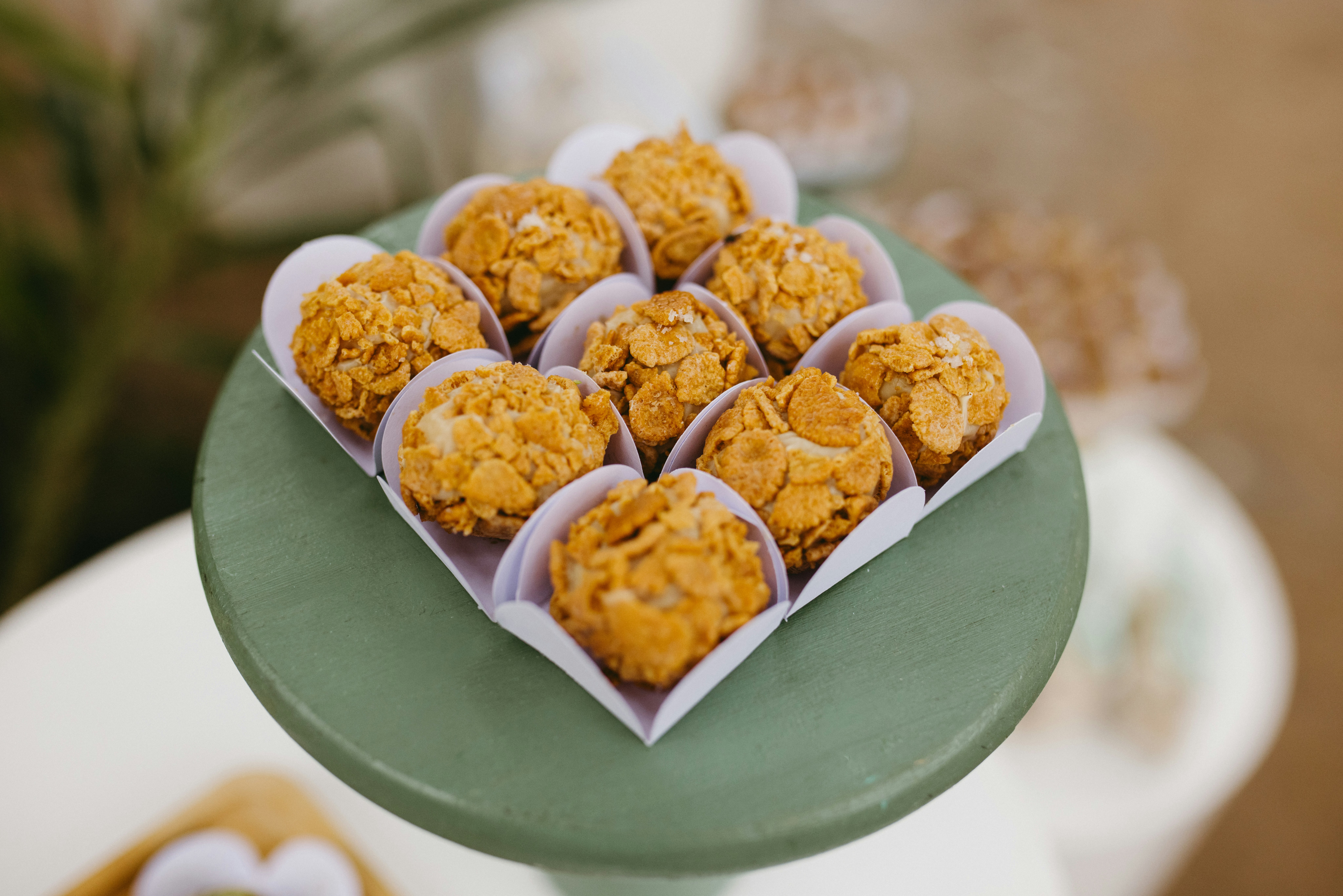 Sweet treats arranged on a green stand