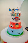 Paw patrol themed birthday cake with three tiers.