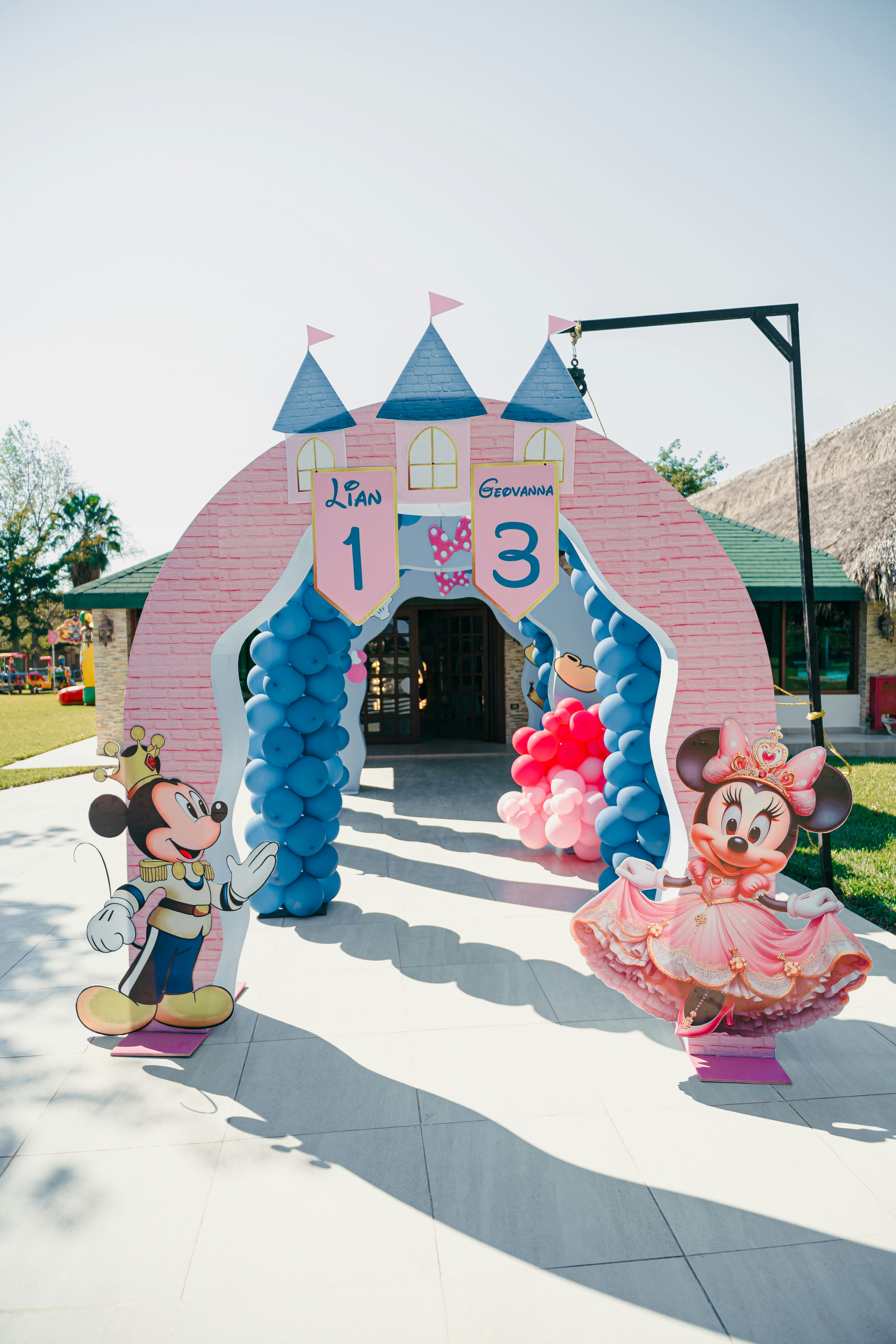 Mickey and minnie mouse castle entrance for a birthday party.