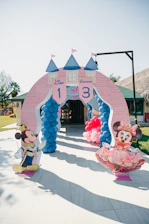 Mickey and minnie mouse castle entrance for a birthday party.