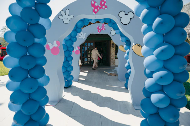 Blue balloon archway decorated with mickey mouse theme