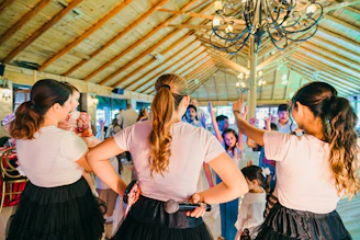 Women dancing and singing at a party