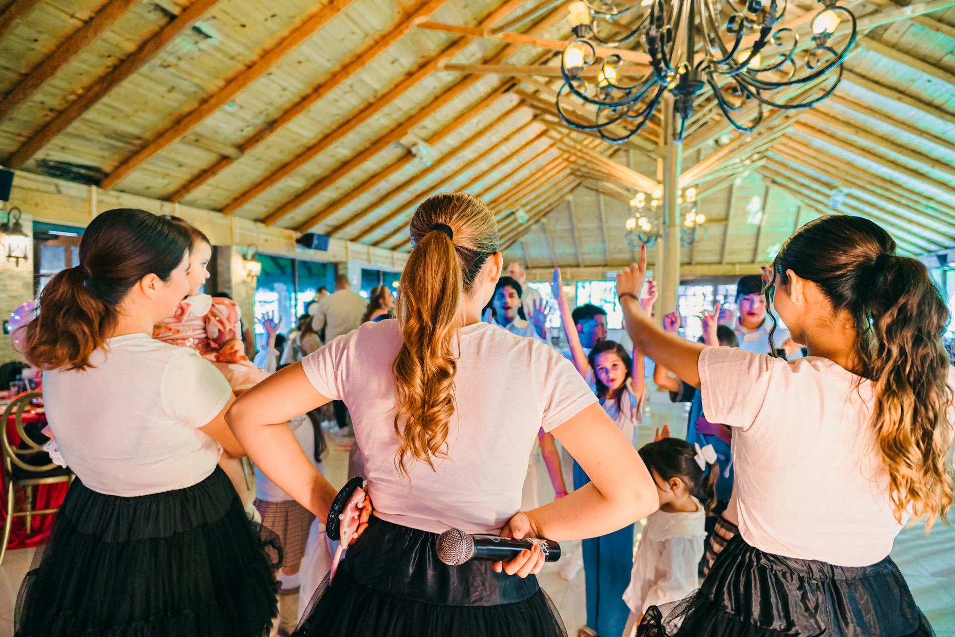 Women dancing and singing at a party