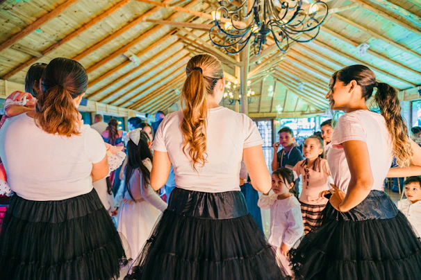 People dancing at a lively indoor gathering