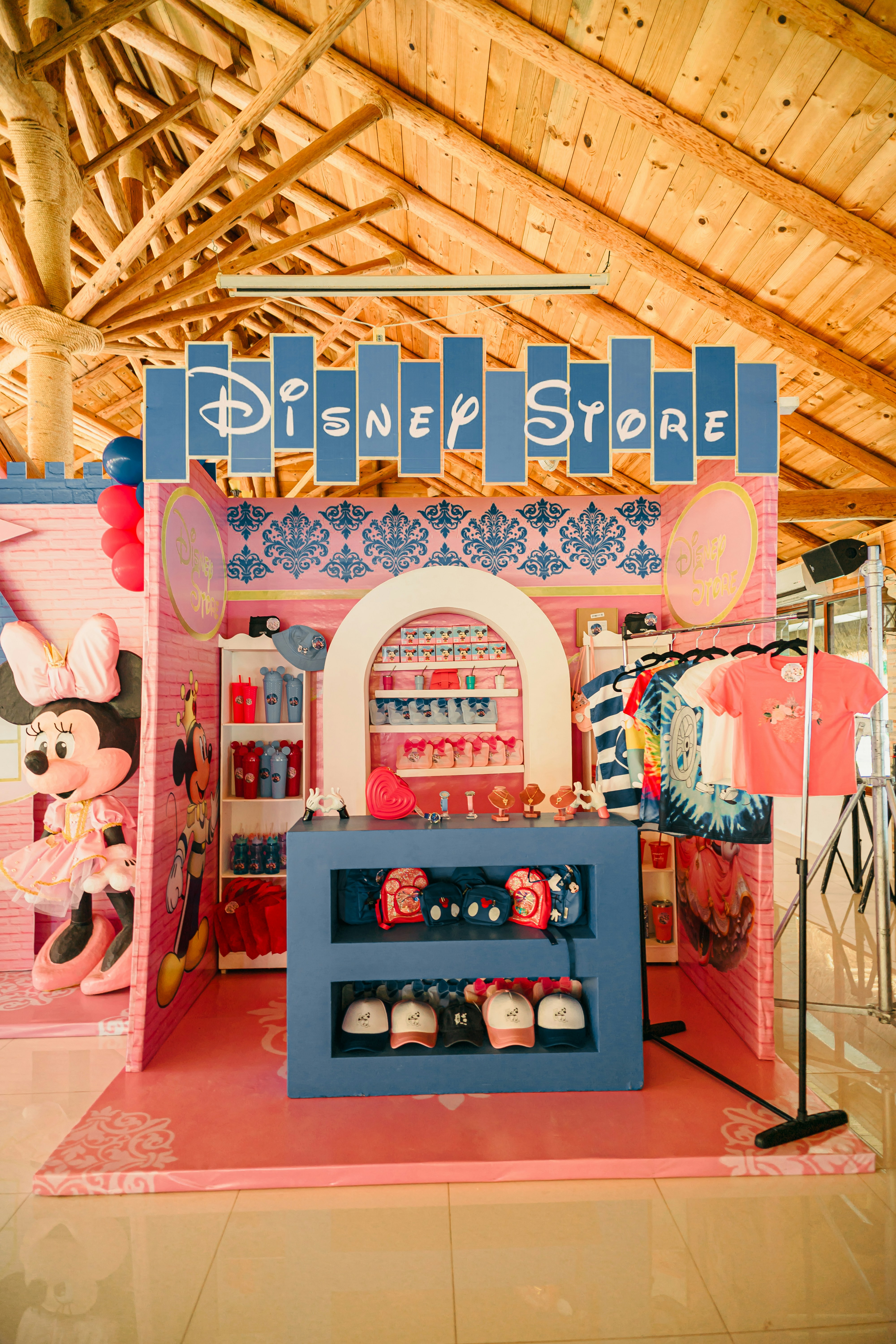 A disney store with minnie mouse decorations and merchandise