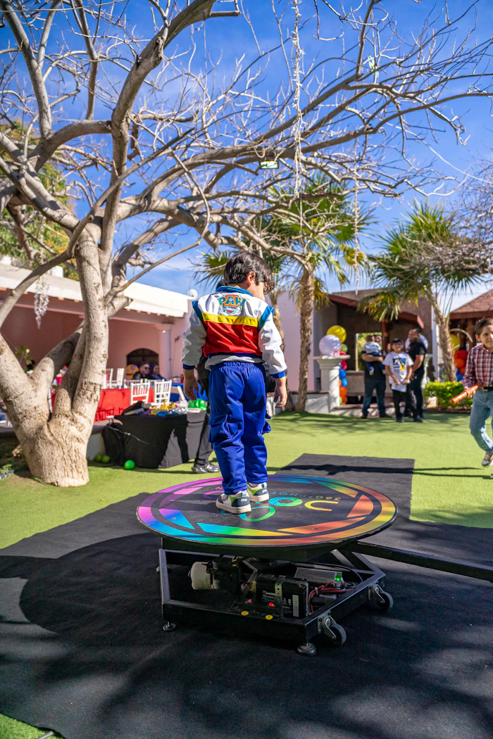 Guest standing on a spinning 360 photo booth platform
