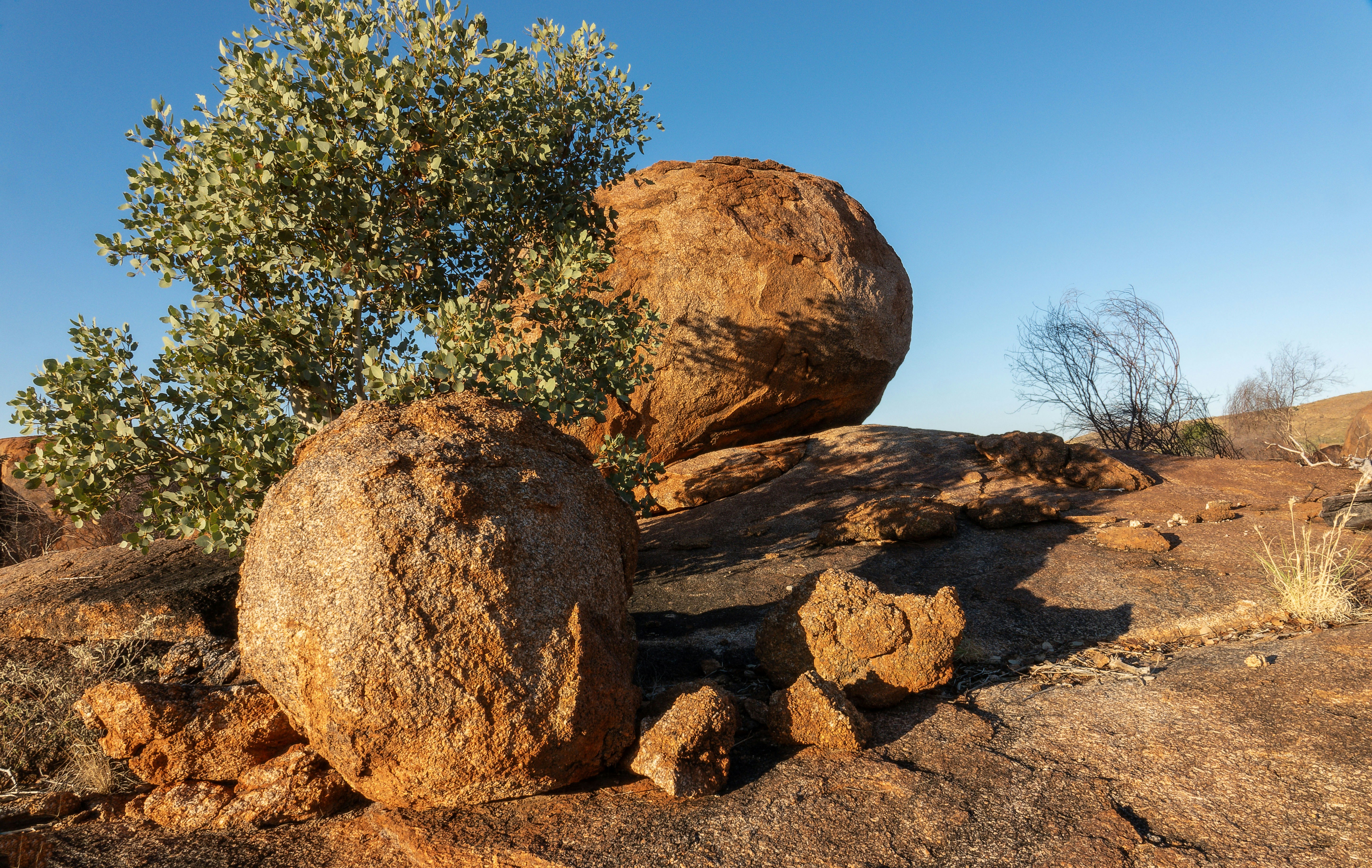 Large round boulders on a rocky, arid landscape.