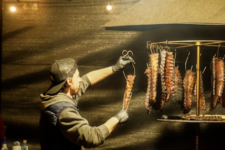 Man hanging ribs for smoking