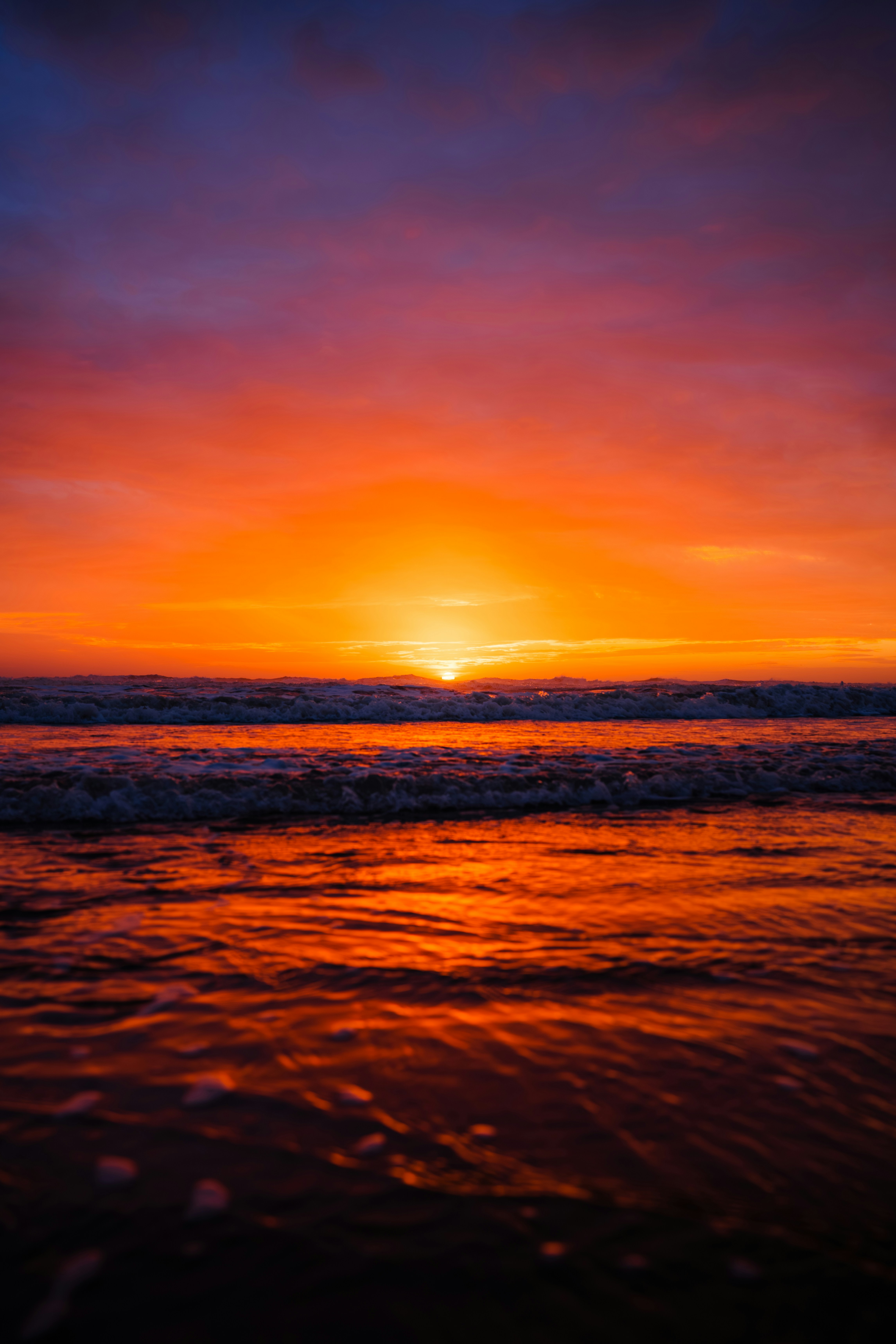 Vibrant sunset over the ocean waves