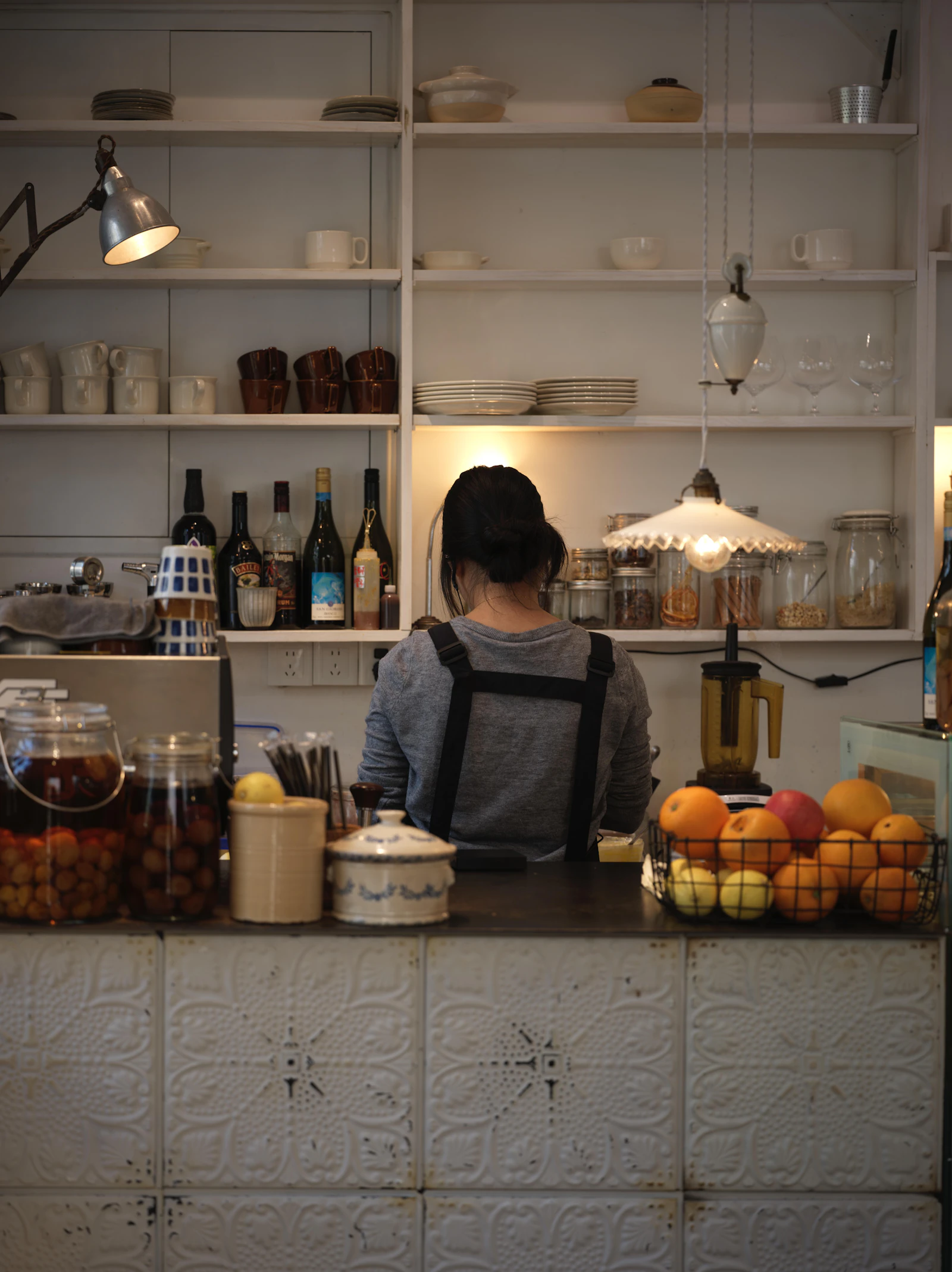 Small business worker behind a shop counter