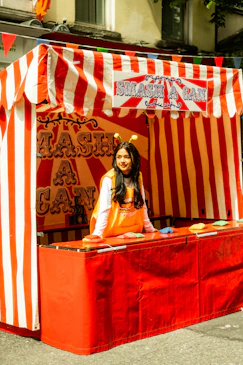 Young woman at a carnival game booth