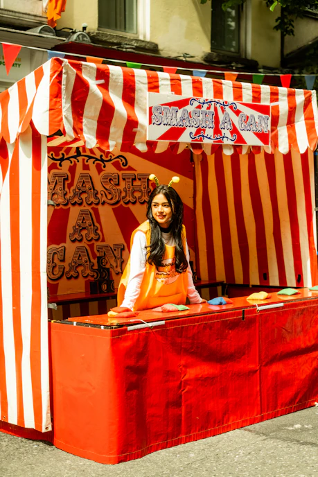 Young woman at a carnival game booth