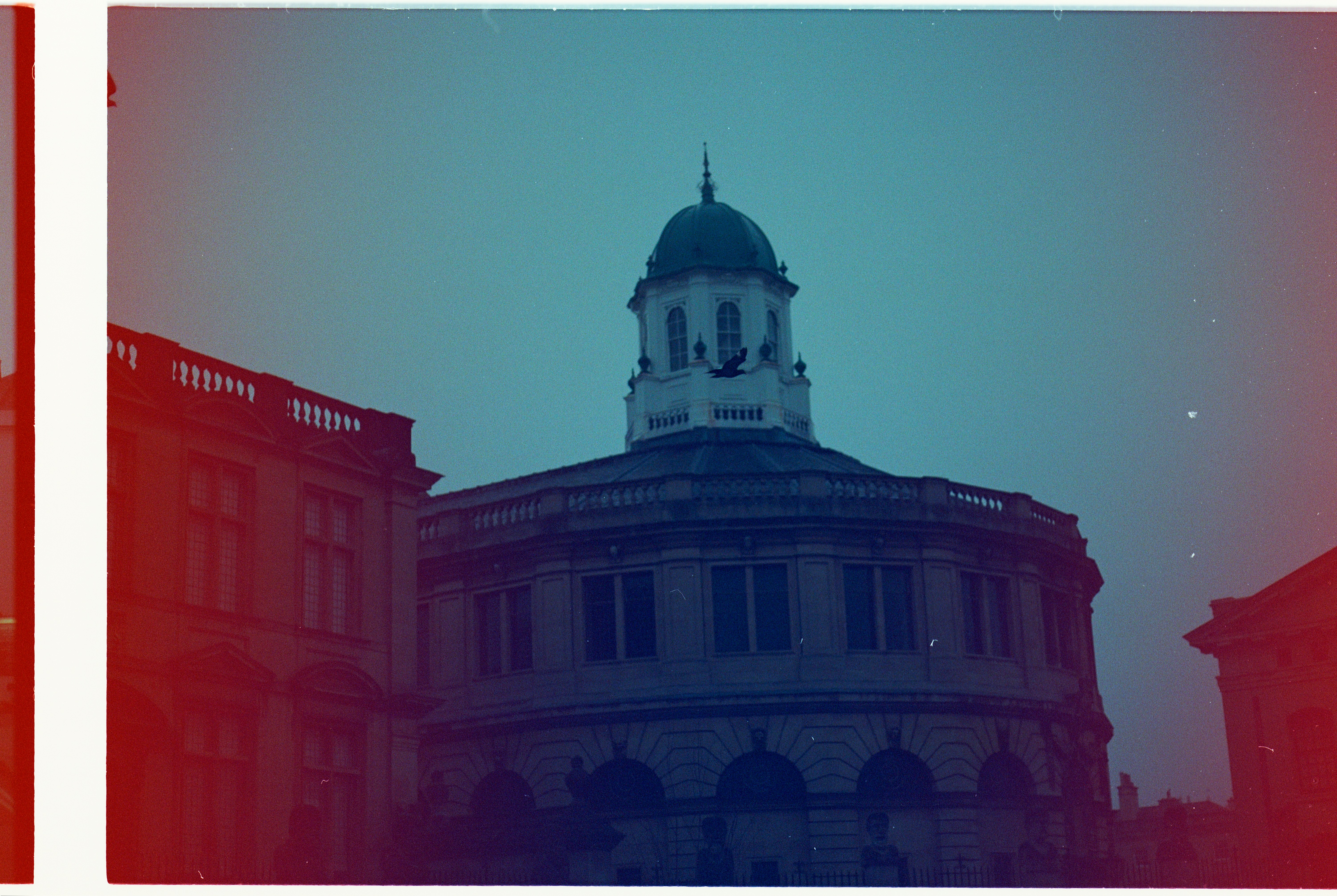 Ornate building with a dome against a teal sky - Free Photo on Unsplash