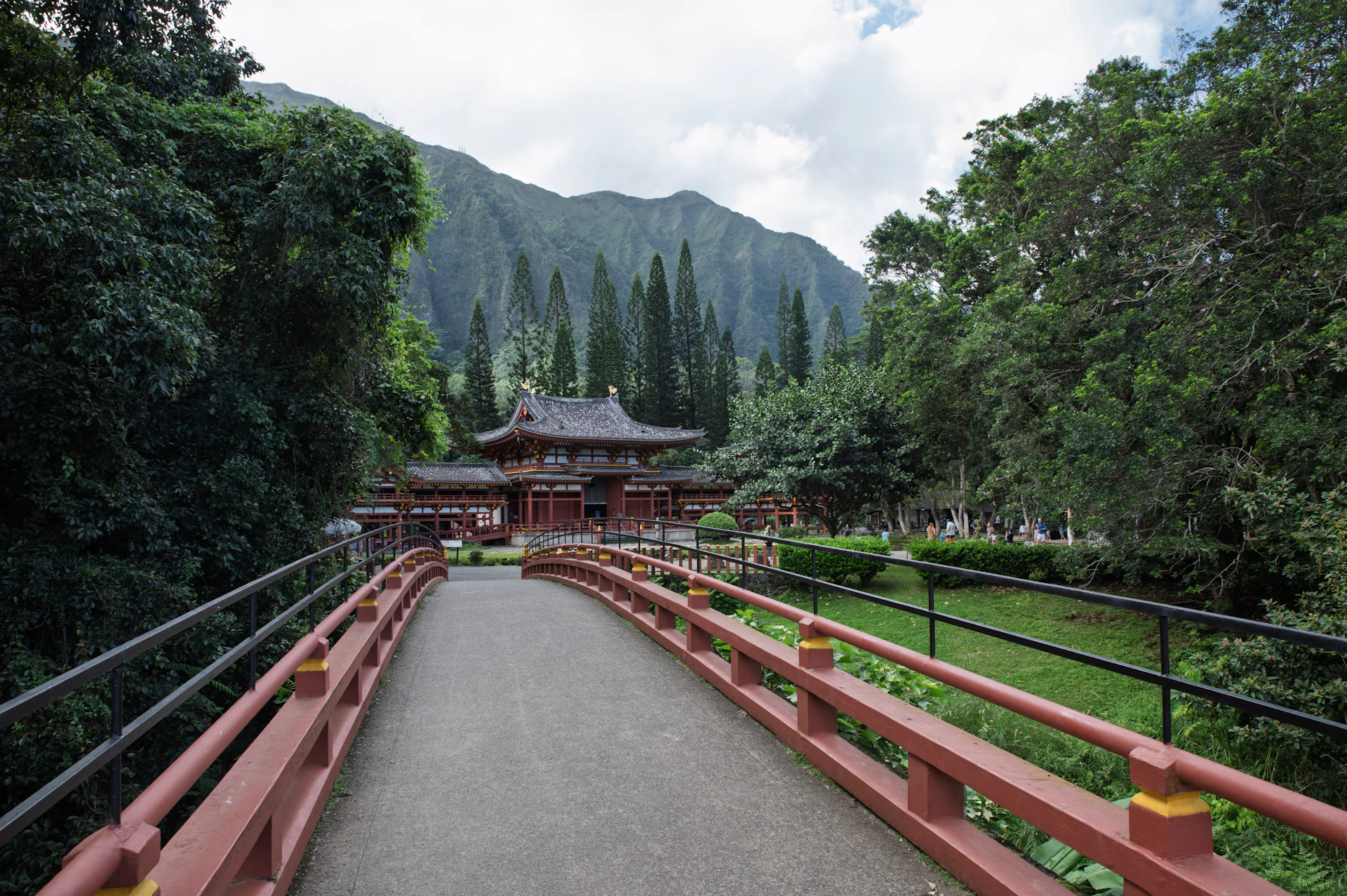 A traditional japanese temple surrounded by lush green trees.