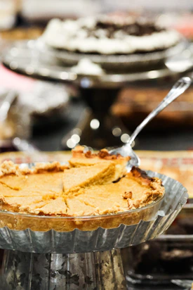 A slice of pie being served from a pie dish