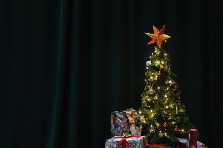 Decorated christmas tree with gifts and star