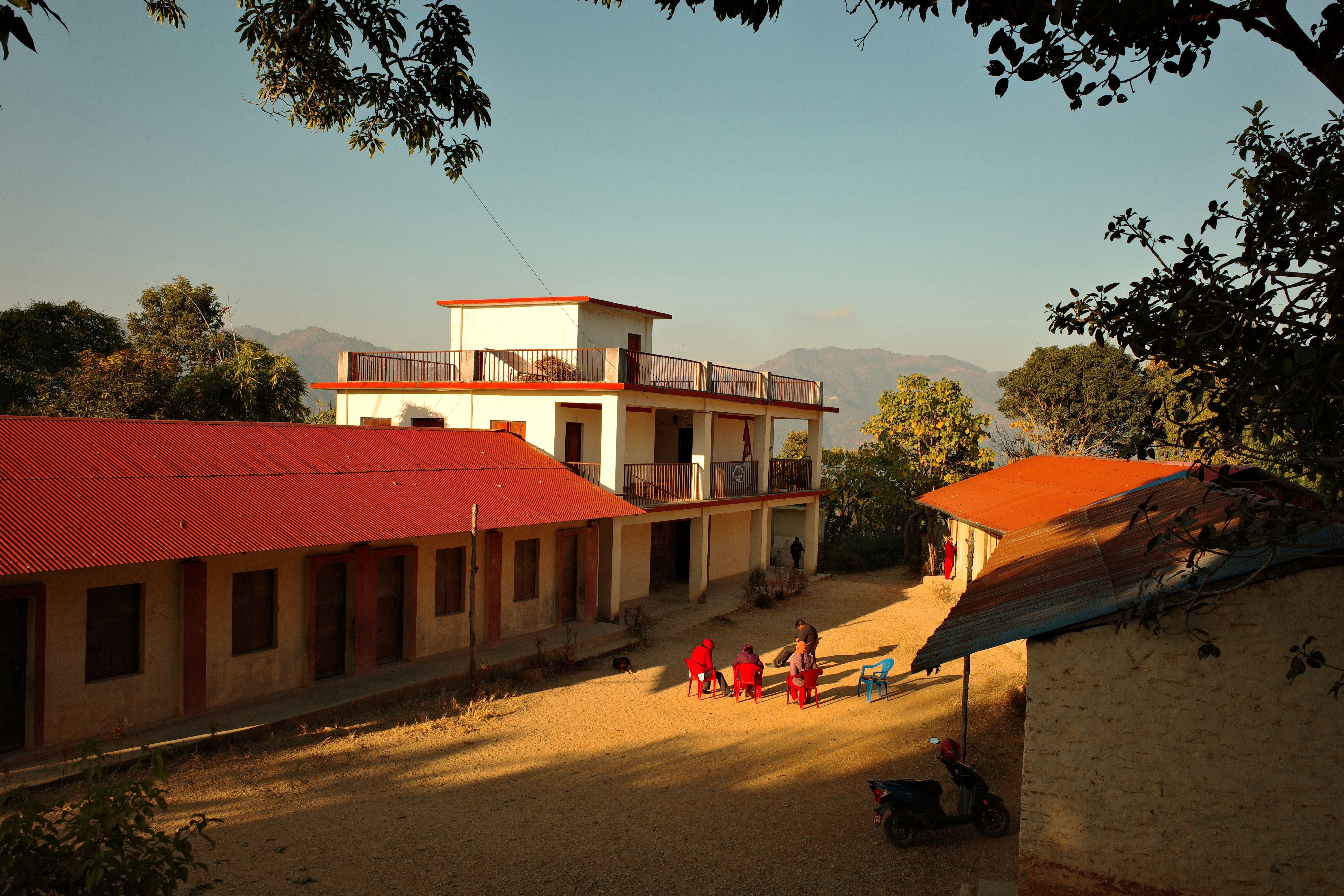 School buildings with children playing in courtyard