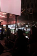 People working at a control desk with screens.